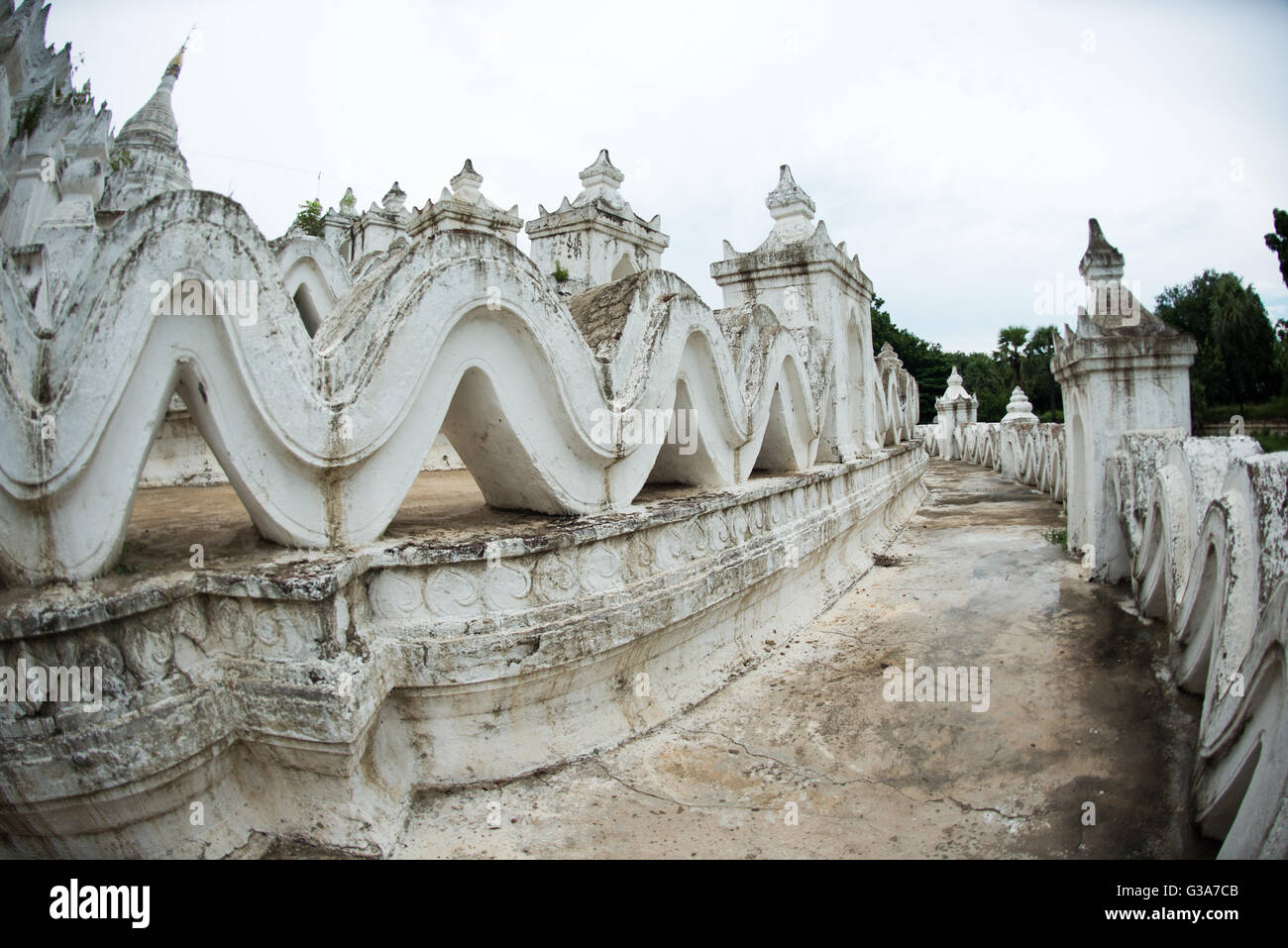 MINGUN, Myanmar (Burma) — Built in 1816 and located in Mingun, not far from Mandalay, Hsinbyume Pagoda is designed in inspiration from Buddhist mythological mountain, Mount Meru. It features 7 levels of distinctive and unique whitewashed waves. Stock Photo