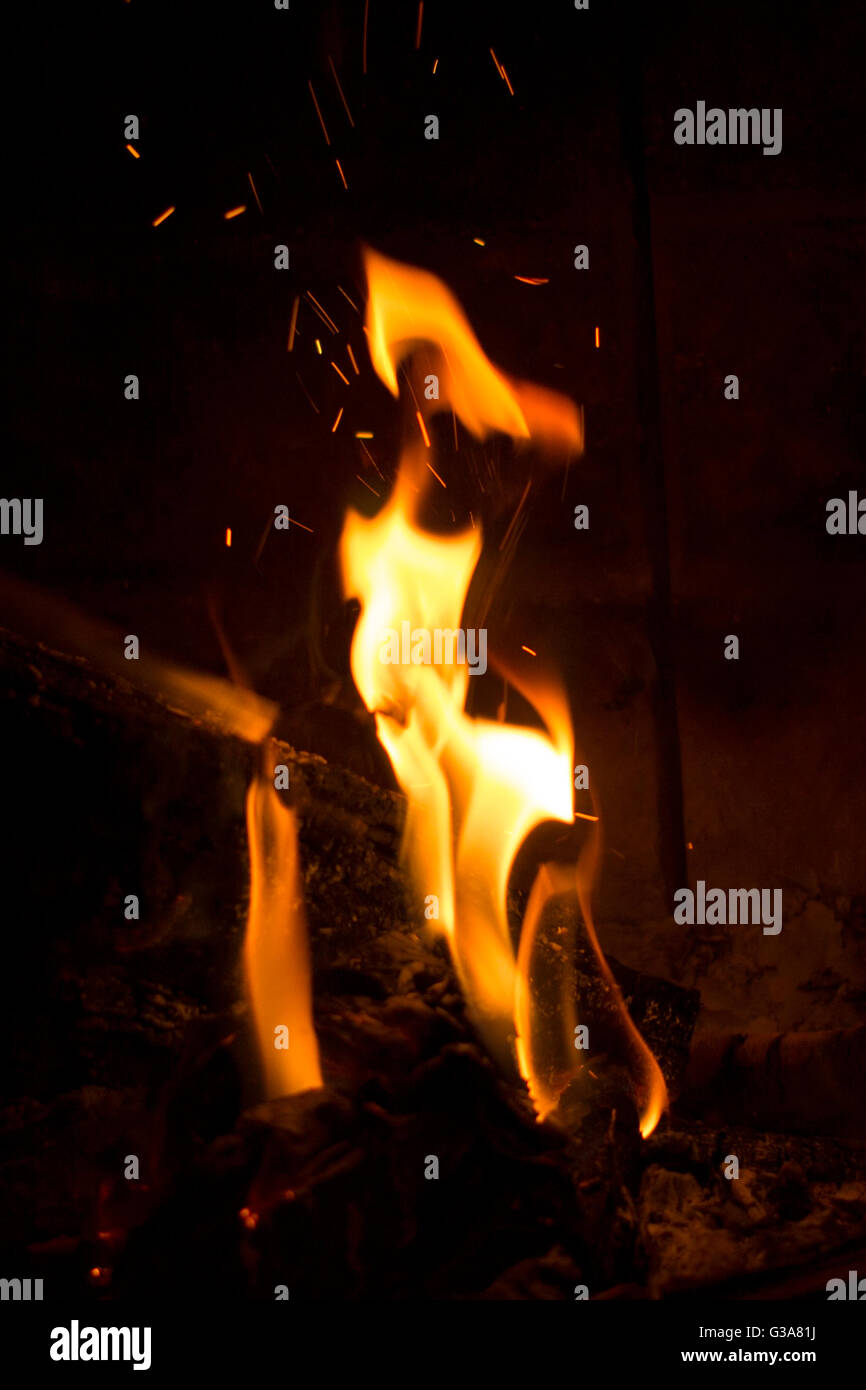 A fire burning in a stone fireplace Stock Photo Alamy