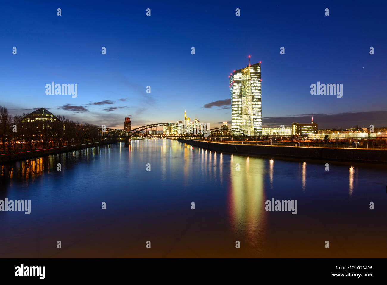 European Central Bank (ECB) with bridge Deutschherrnbrücke over the river Main, in the background the financial district, German Stock Photo