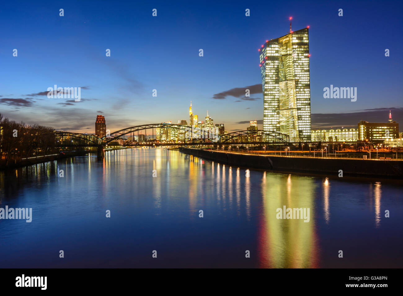 European Central Bank (ECB) with bridge Deutschherrnbrücke over the river Main, in the background the financial district, German Stock Photo