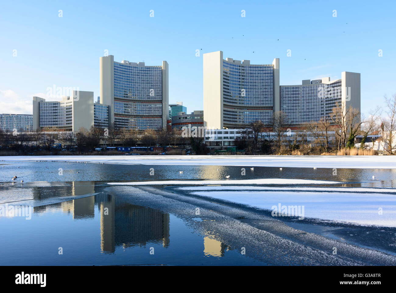 lake Kaiserwasser with ice and snow , UN building, Austria, Wien, 22., Wien, Vienna Stock Photo