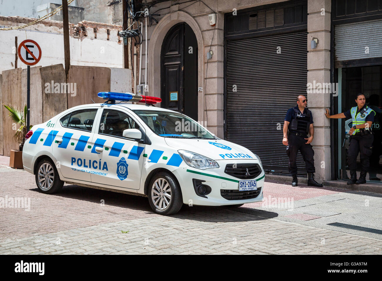 A street scene with police car in Montevideo, Uruguay, South America. Stock Photo