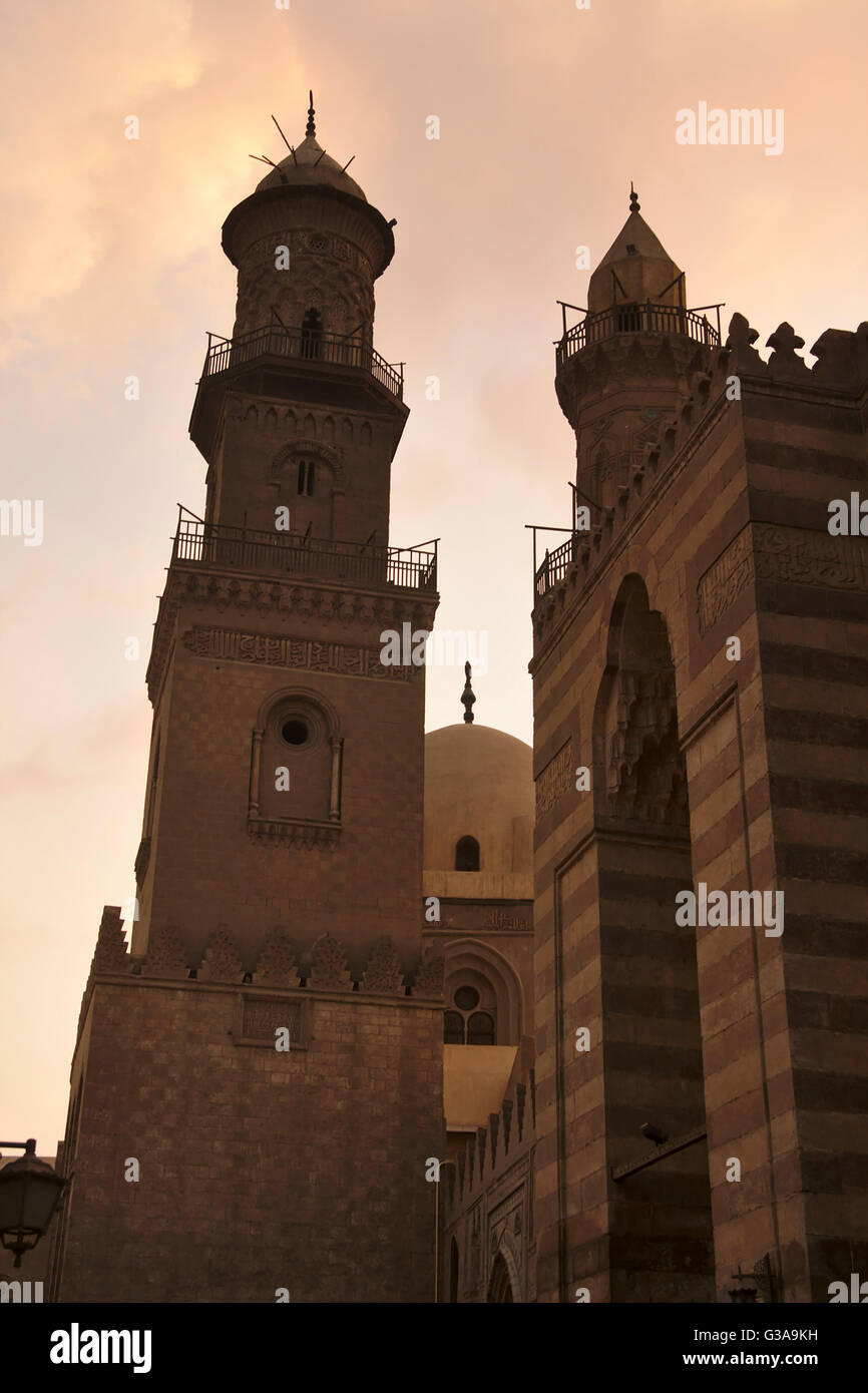 Cairo, Minaret and dome of Qalawun complex, minaret of Madrasa al-Nasir Muhammmad, portal of Barquq complex, dusk, Egypt Stock Photo