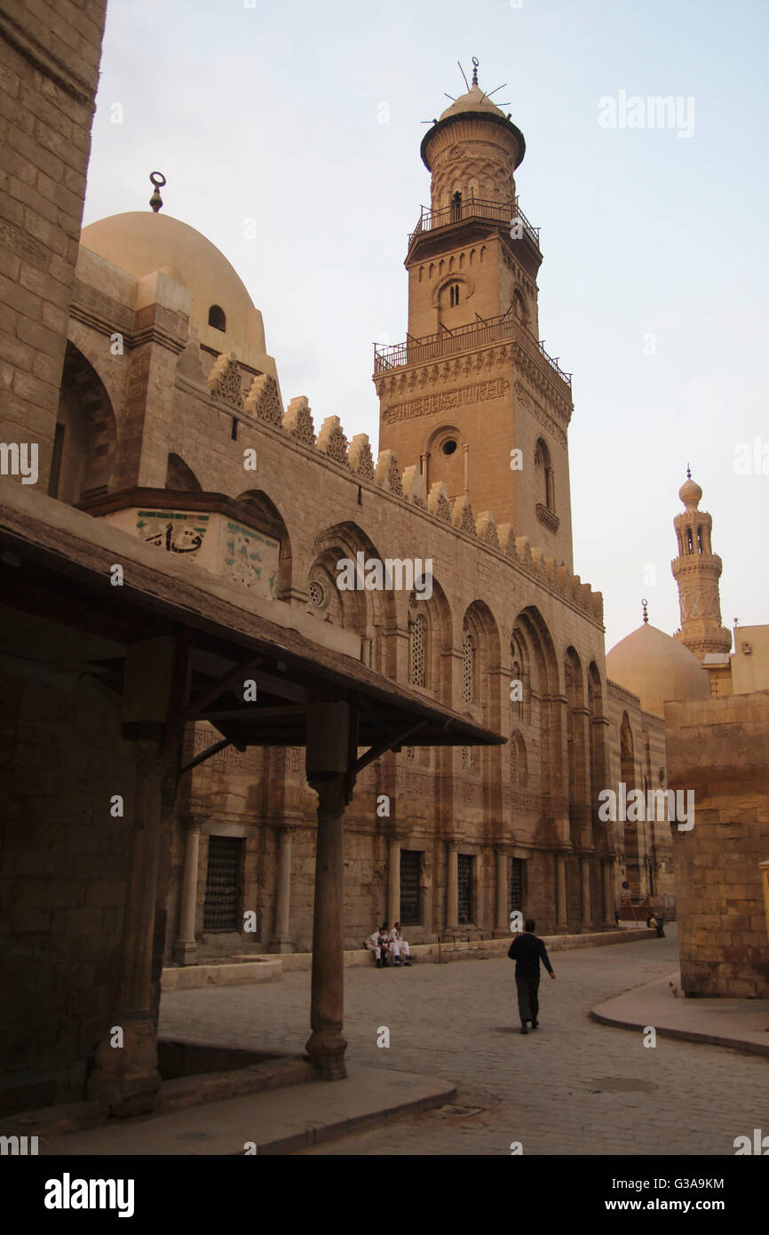 Cairo, Qalawun complex, mausoleum with dome and minaret and Al-Muizz li-Din Allah street, with Barquq complex in the background Stock Photo