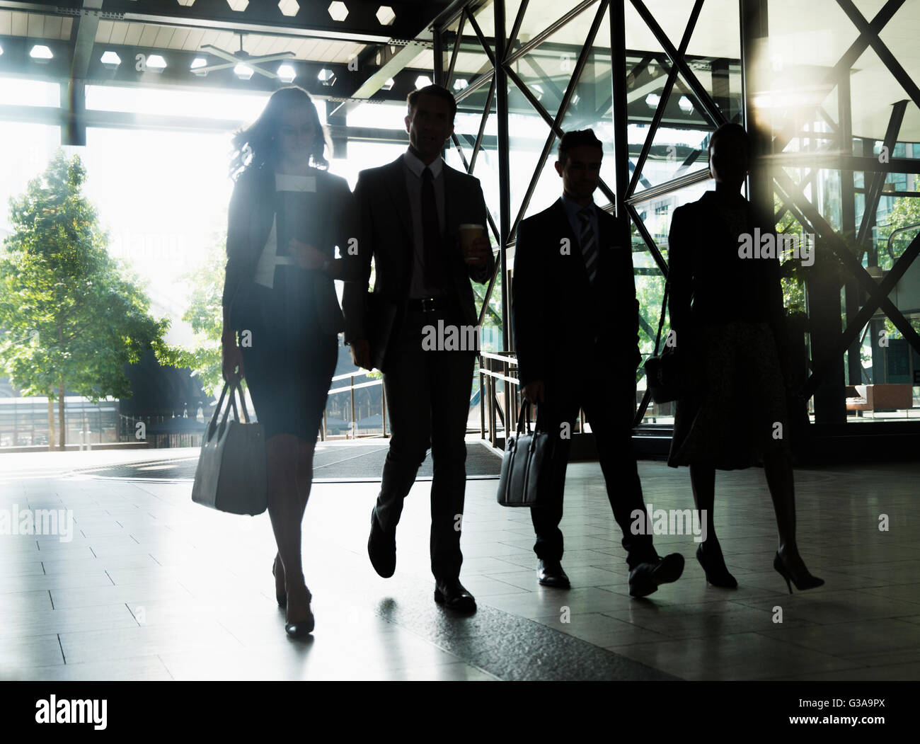 Corporate business people walking outside building Stock Photo