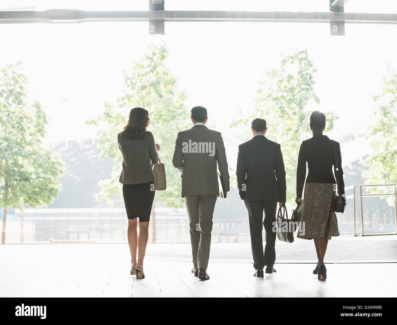 Corporate business people walking in a row Stock Photo