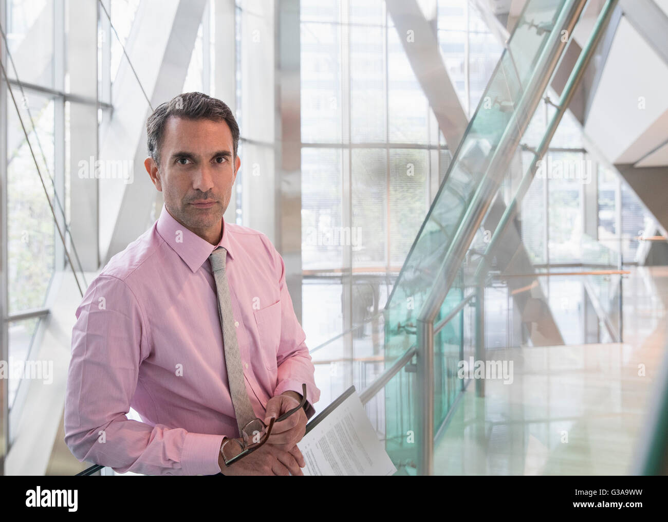 Portrait serious corporate businessman in modern office lobby Stock Photo