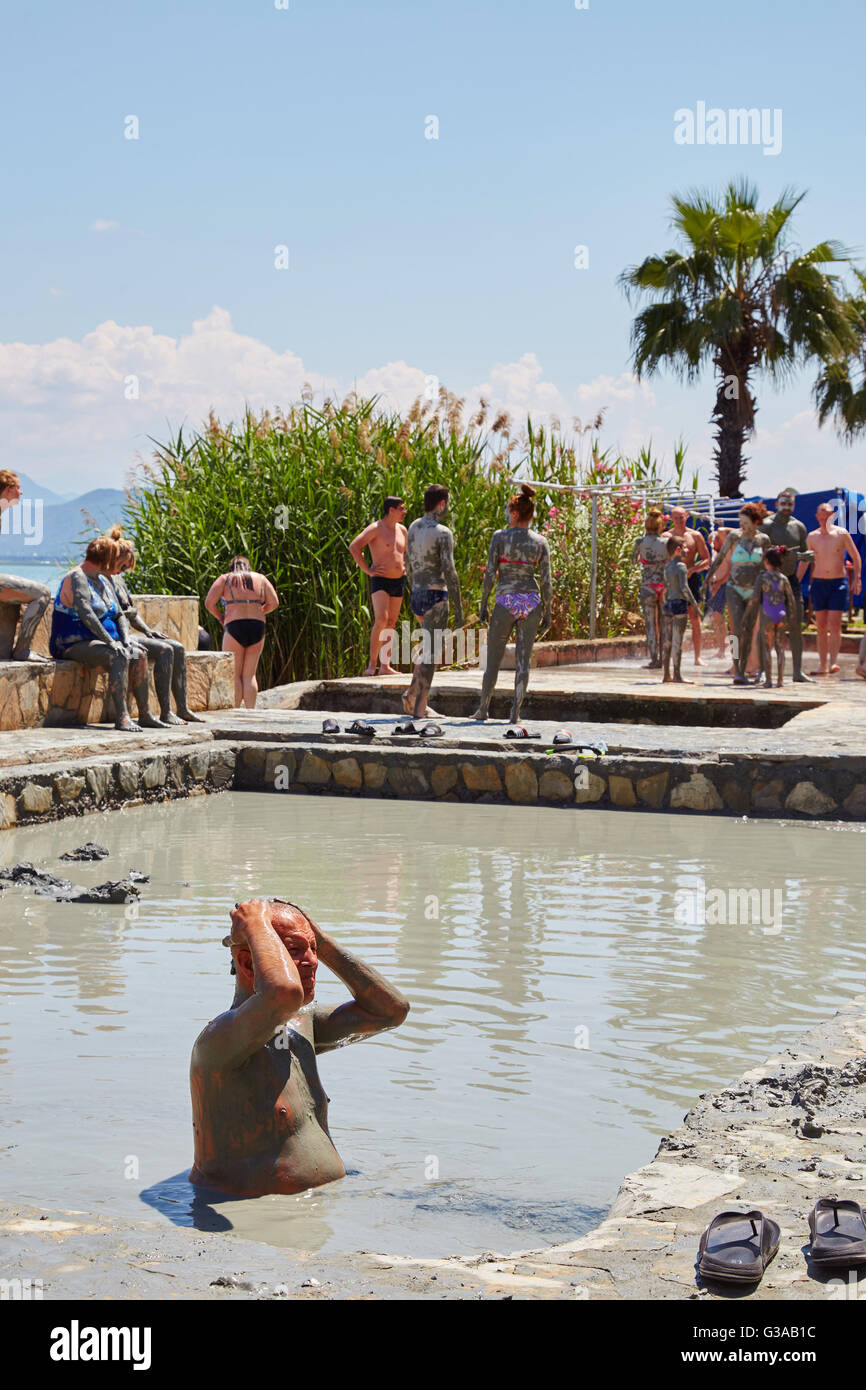 People taking a mud bath, thermal spa on Lake Koycegiz, Sultaniye, near Dalyan, Mugla Province, Turkey. Stock Photo