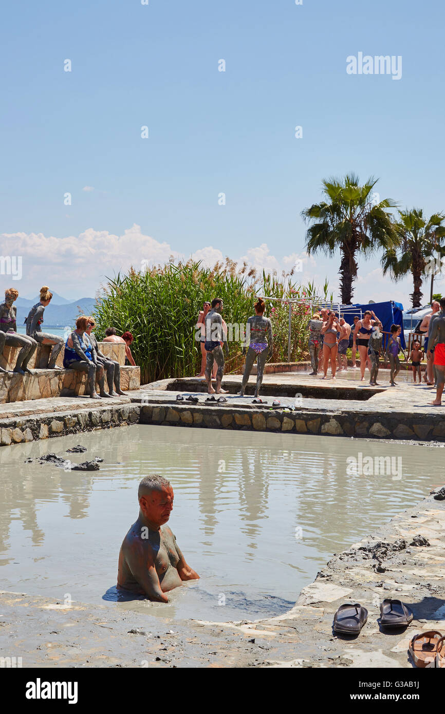 People taking a mud bath, thermal spa on Lake Koycegiz, Sultaniye, near Dalyan, Mugla Province, Turkey. Stock Photo