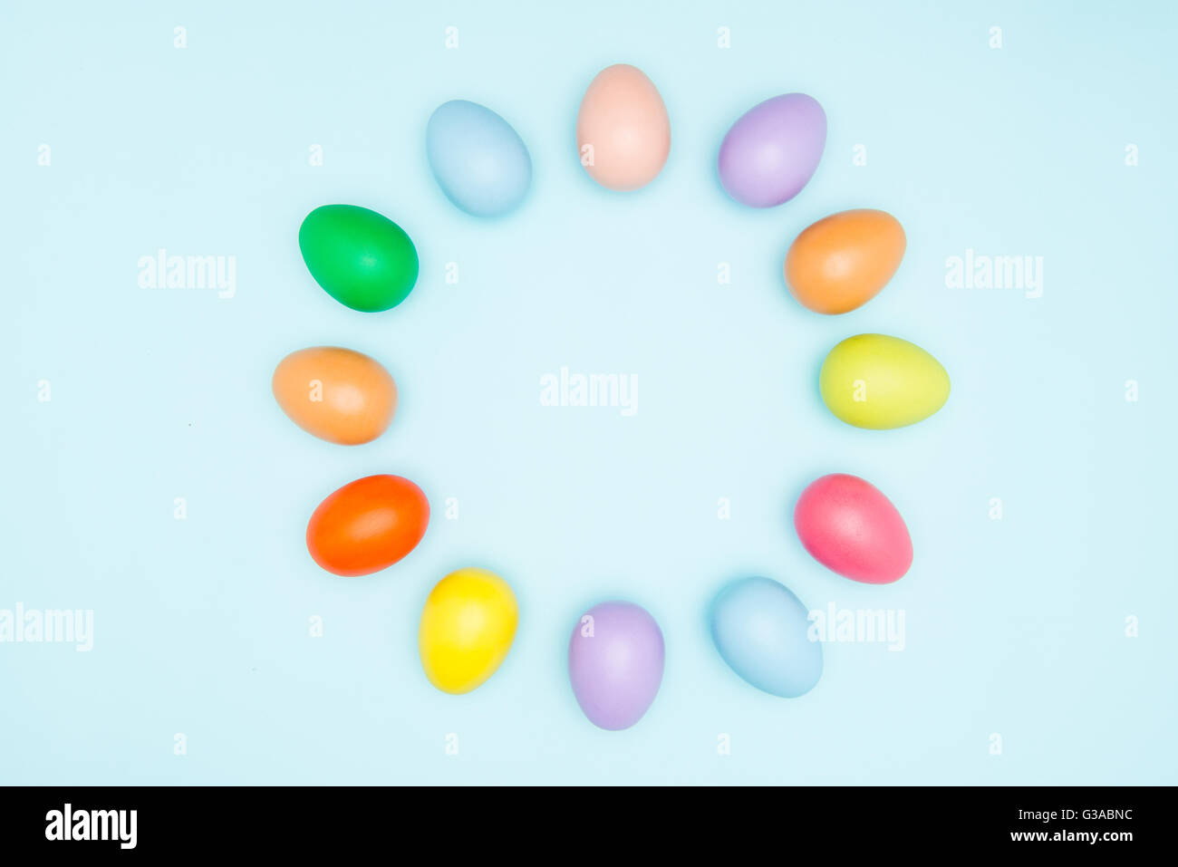 Colorful easter eggs arranged in a circular on pastel background Stock ...