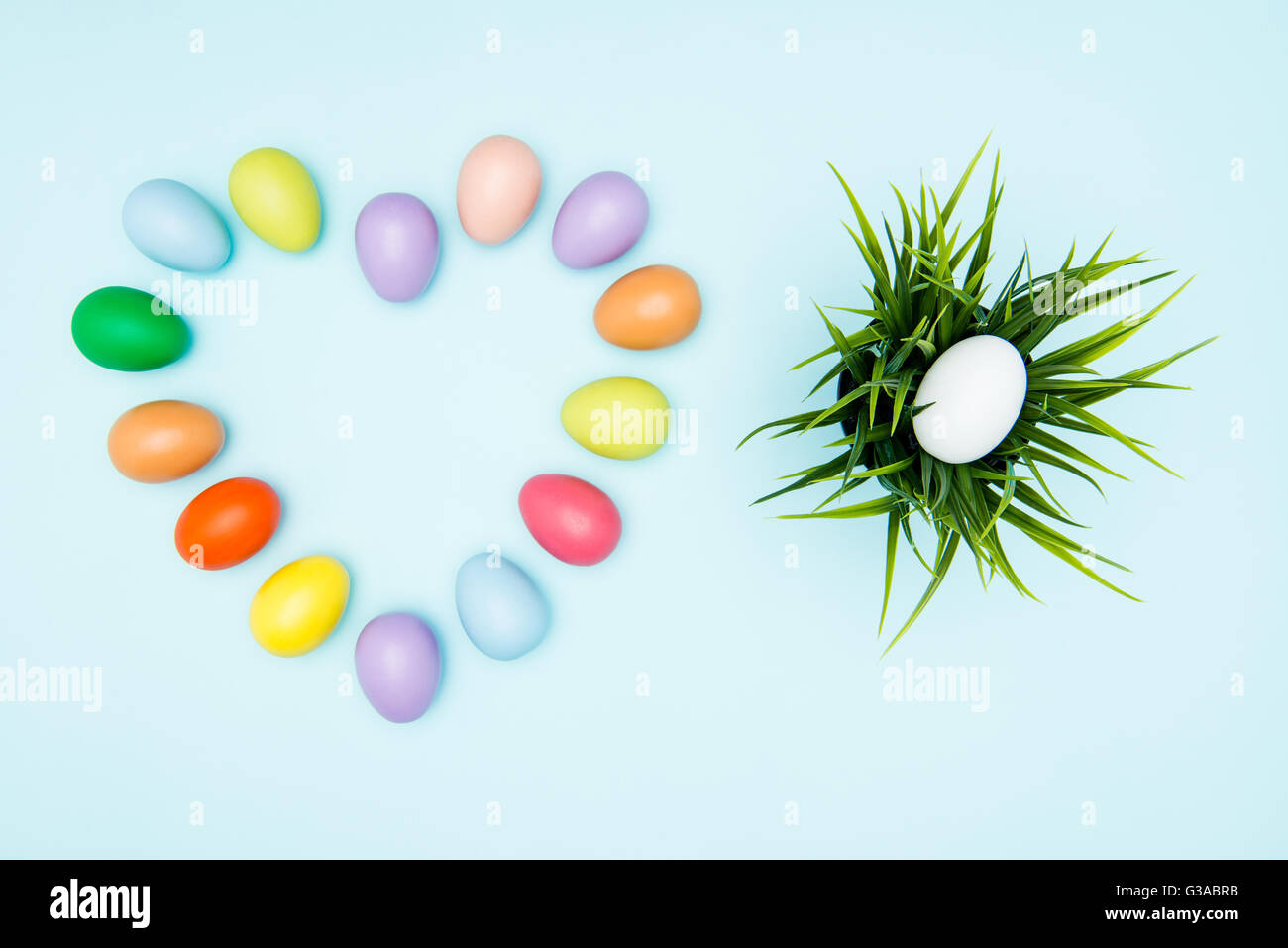 Colorful easter eggs arranged in love shape on pastel background Stock ...