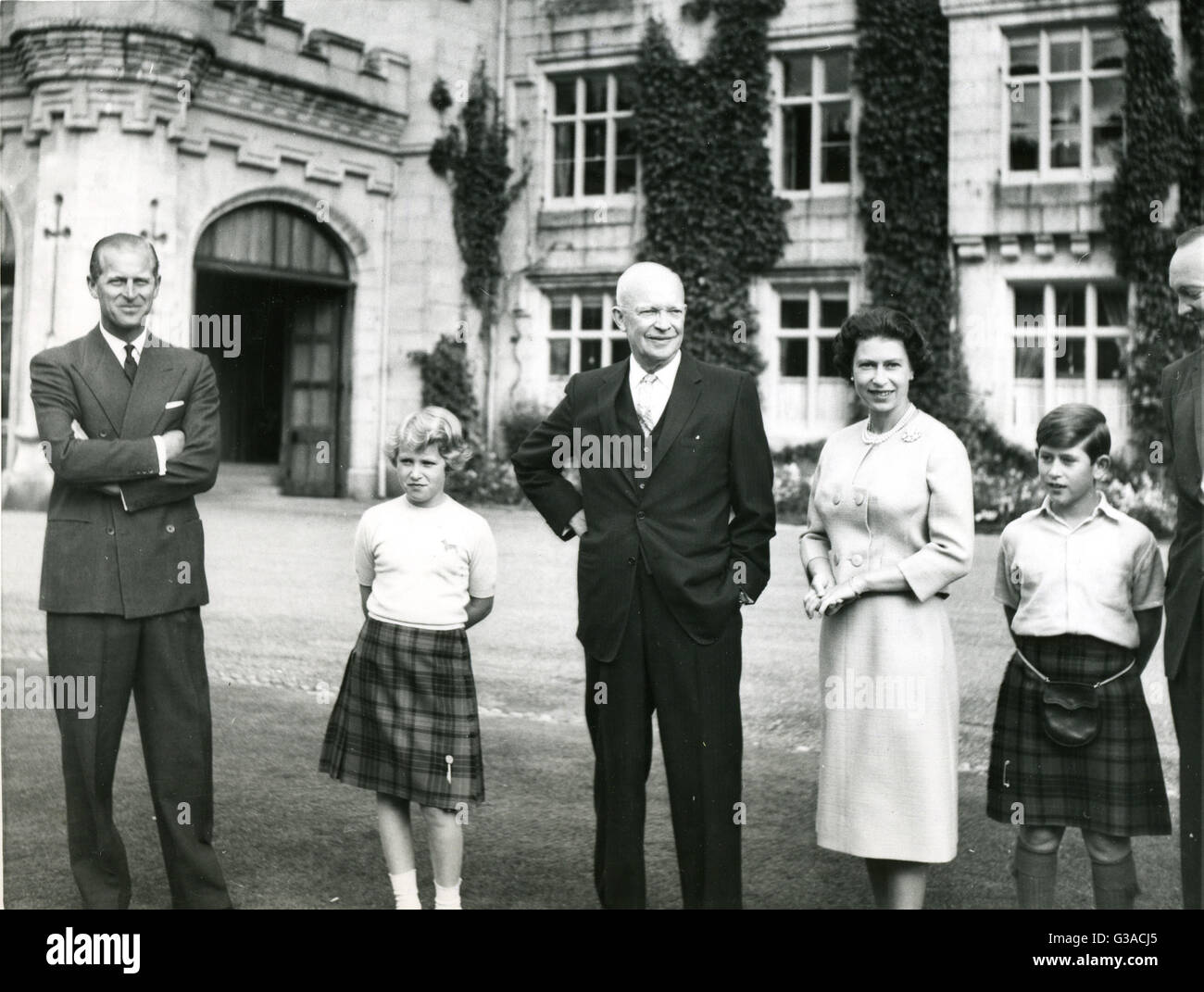 President of the United States, Dwight D. Eisenhower stands outside Balmoral Castle with members of the British Royal family. Left to right: Prince Philip, Princess Anne; The President; Queen Elizabeth; and Prince Charles. The President was visiting England for top level talks with British Prime Minister Harold Macmillan. Stock Photo