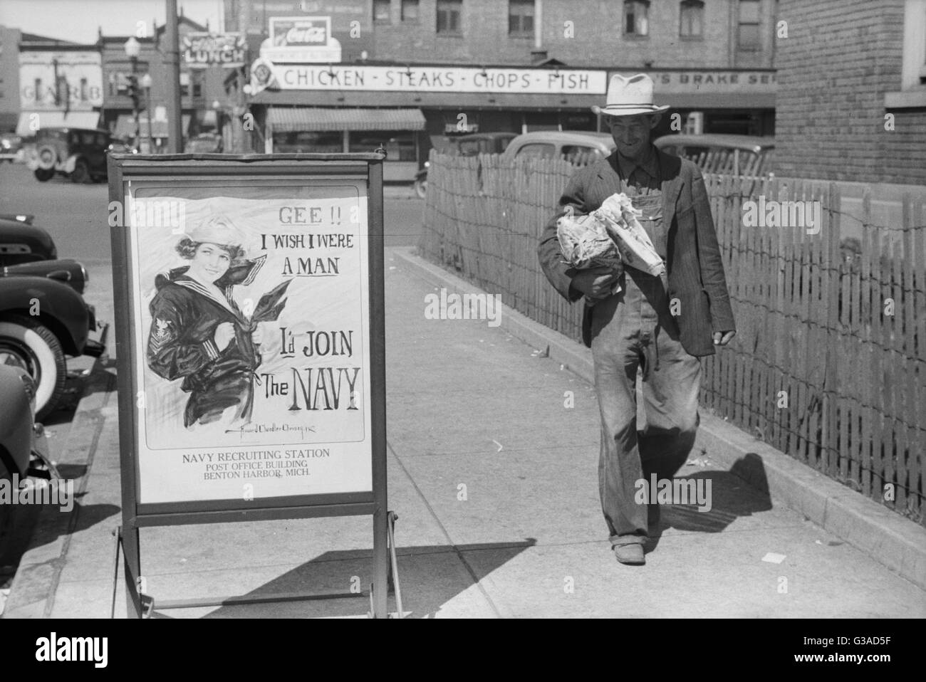 Migrant fruit worker from Arkansas walking by the post office, Benton