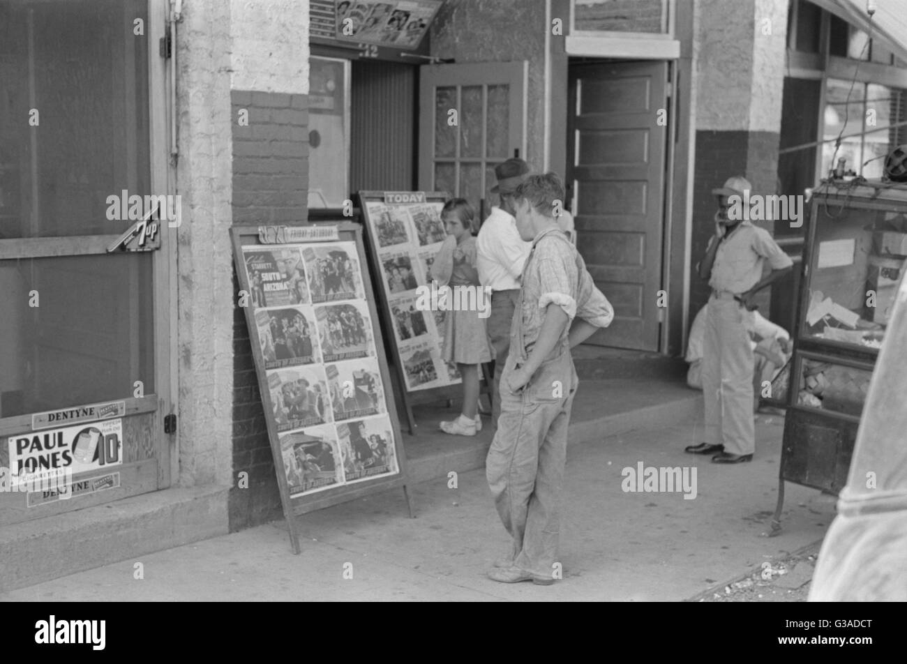 Children looking at posters in front of movie, Saturday, Ste Stock Photo