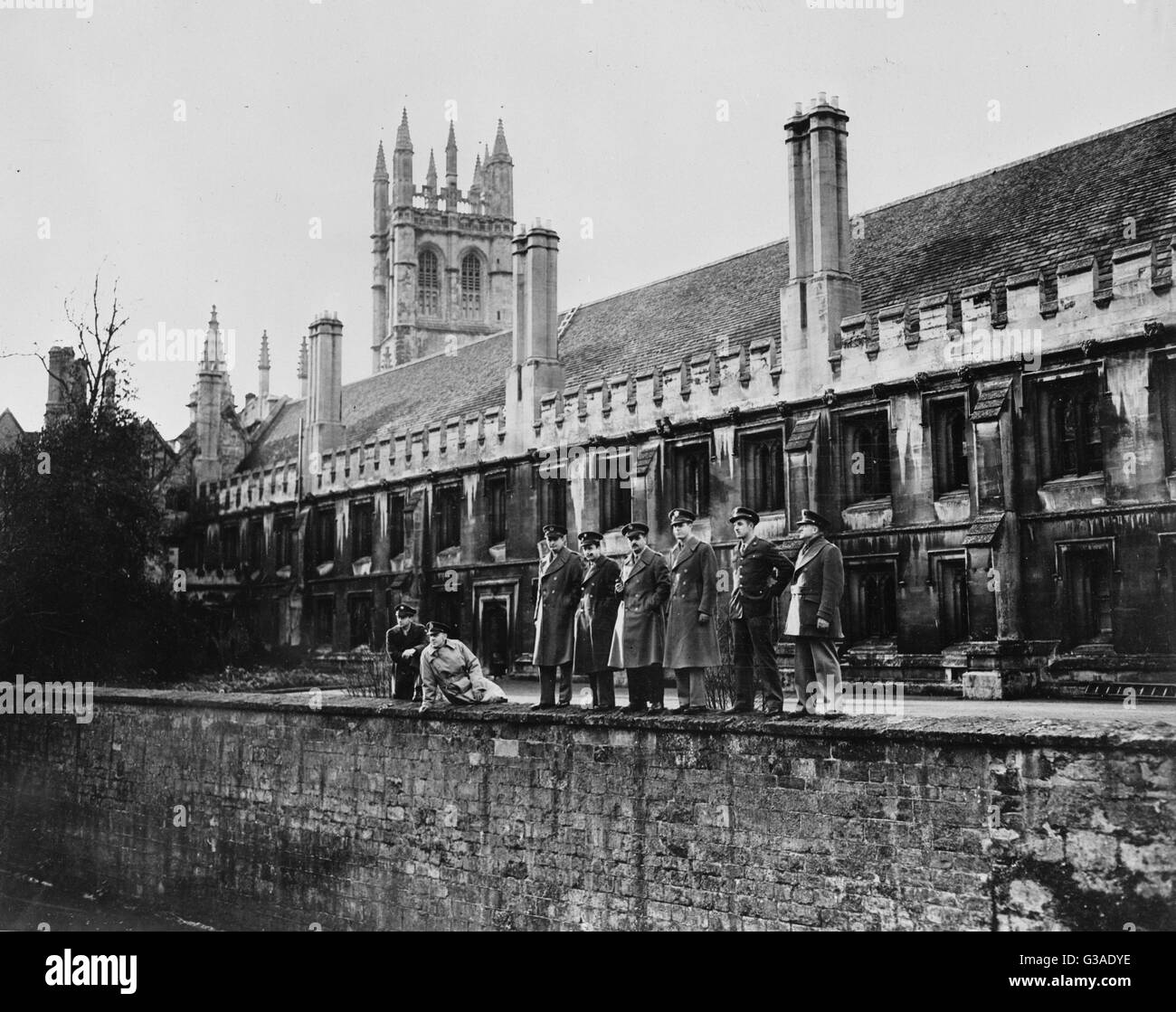Oxford England. American Army men, attending Oxford University for special courses given by distinguished educators, view the Thames River following one of their classes. The tower and buildings of Magdalen college form the background. Left to right: Priv Stock Photo