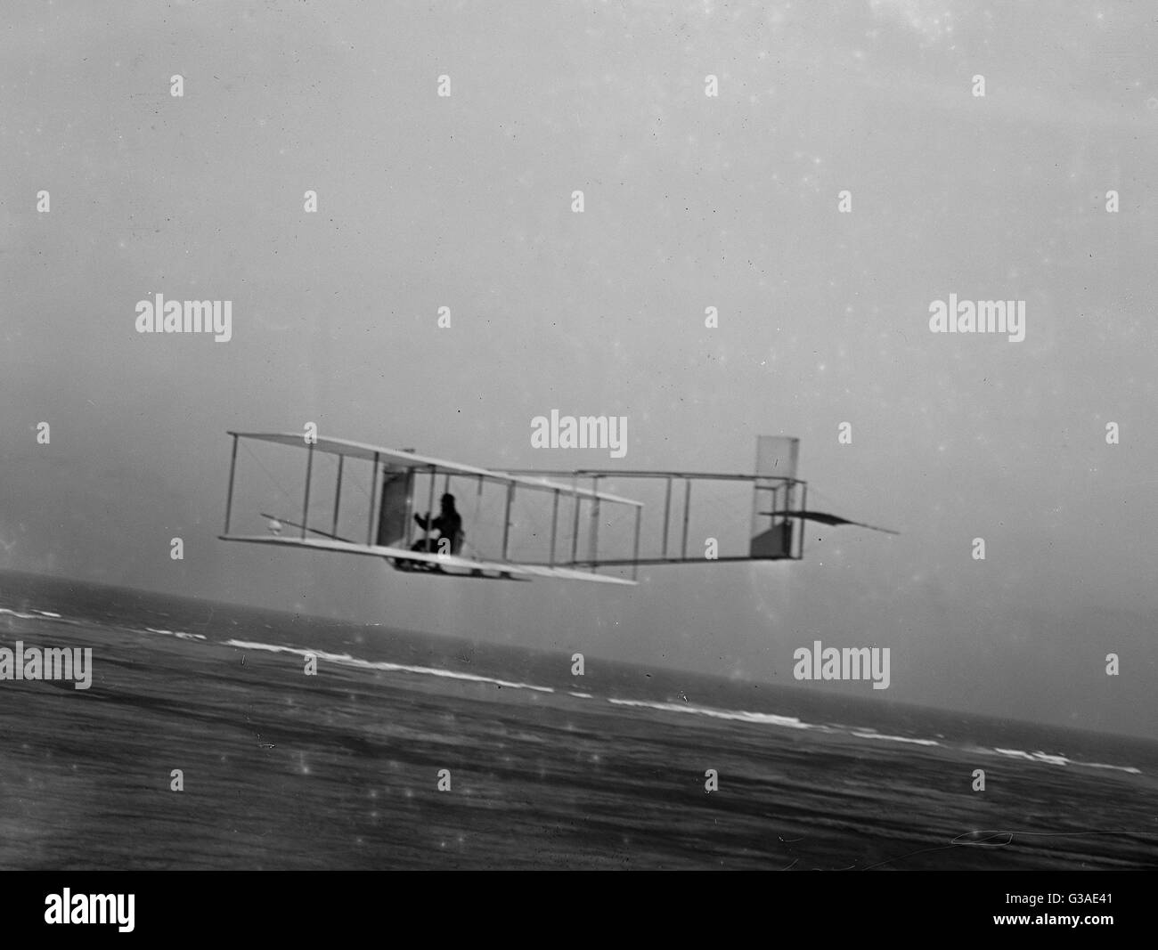 Left rear view of glider at a low altitude, showing the fixe Stock Photo