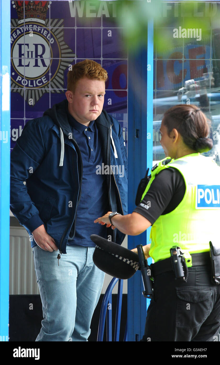 Coronation Streets Craig Tinker (played by Colson Smith) has lost his good boy tag as he has started drinking and getting drunk which has lead his to have a brush with the law. Craig's new drinking buddy Gemma Winter (played by Dolly-Rose Campbell) come the Weatherfield Police Station to help him talk his way out of his arrest. Stock Photo