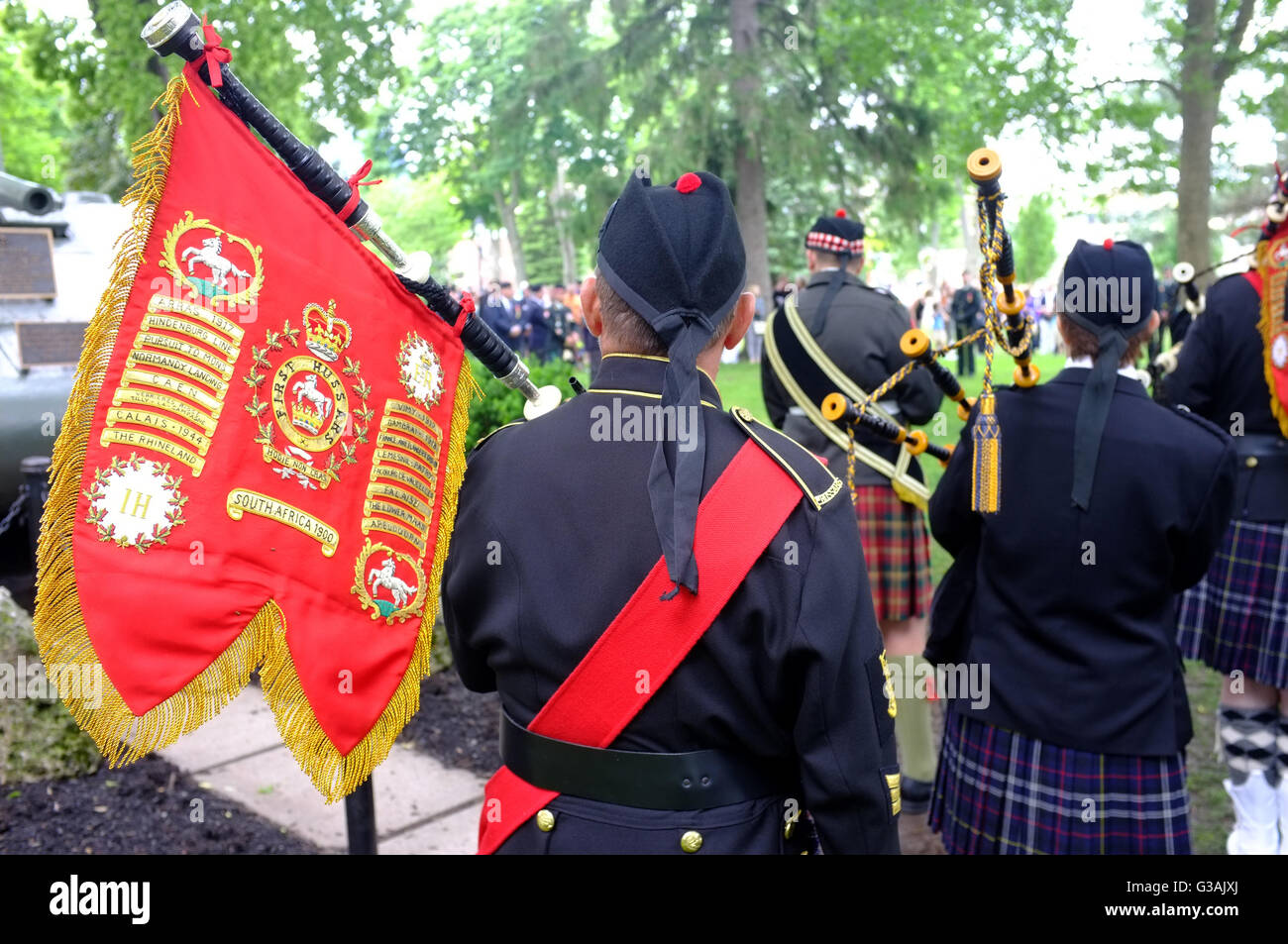 A bagpiper at D-Day anniversary commemorations in London, Ontario in Canada. Stock Photo