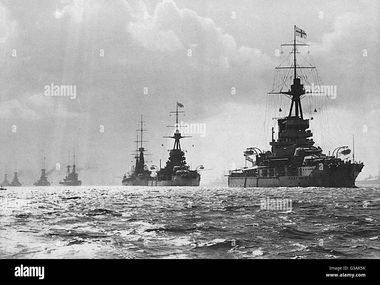 The British Fleet was concentrated at Spithead a fortnight before the outbreak of World War I. Twenty-two miles of warships ranging from Dreadnoughts to Destroyers passed in procession before King George V and the Prince of Wales.     Date: 1914 Stock Photo