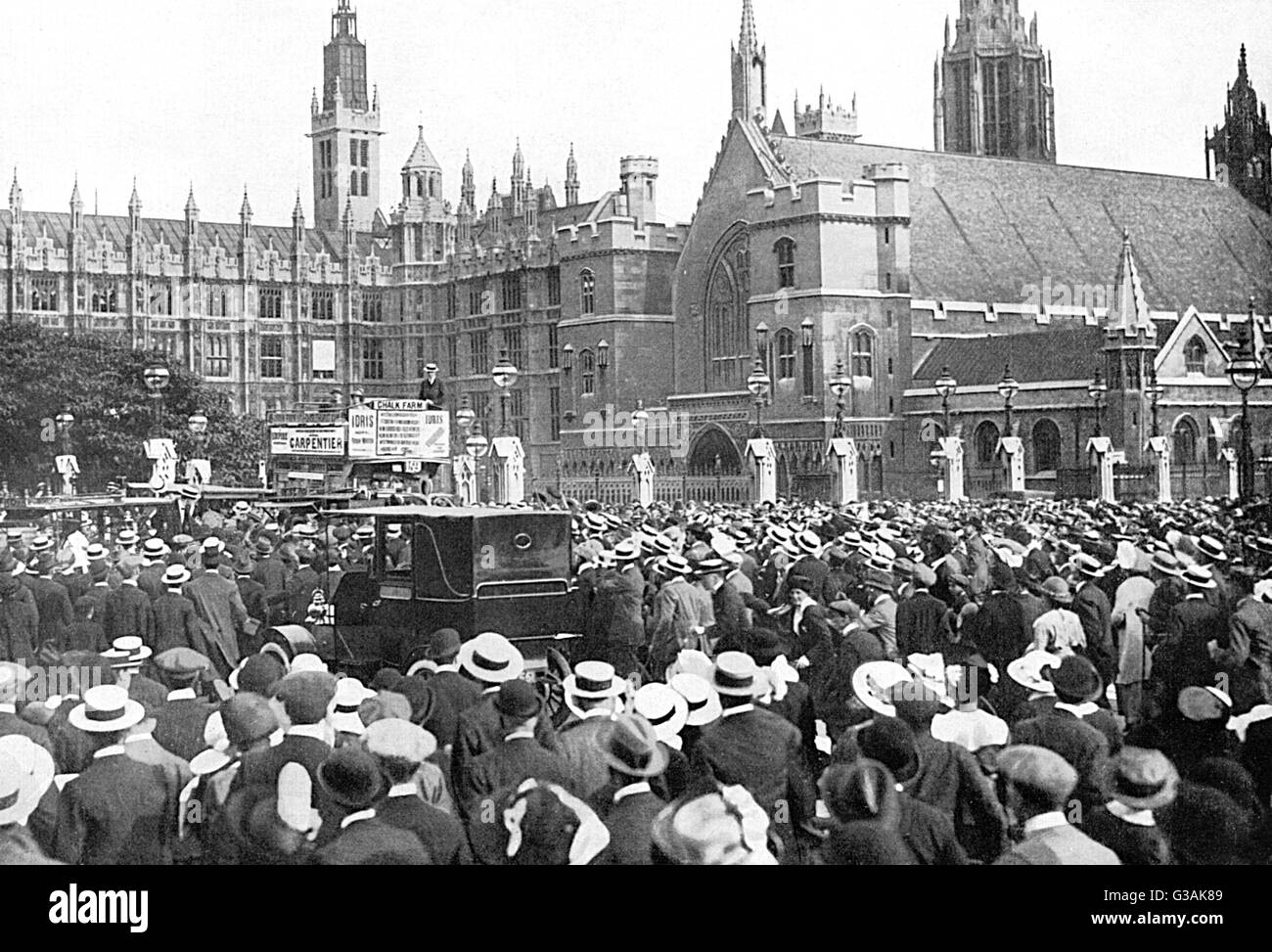 Crowds assemble close to the House of Commons in London, during the afternoon of the August Bank Holiday (3rd August 1914) when war was practically inevitable.     Date: 1914 Stock Photo