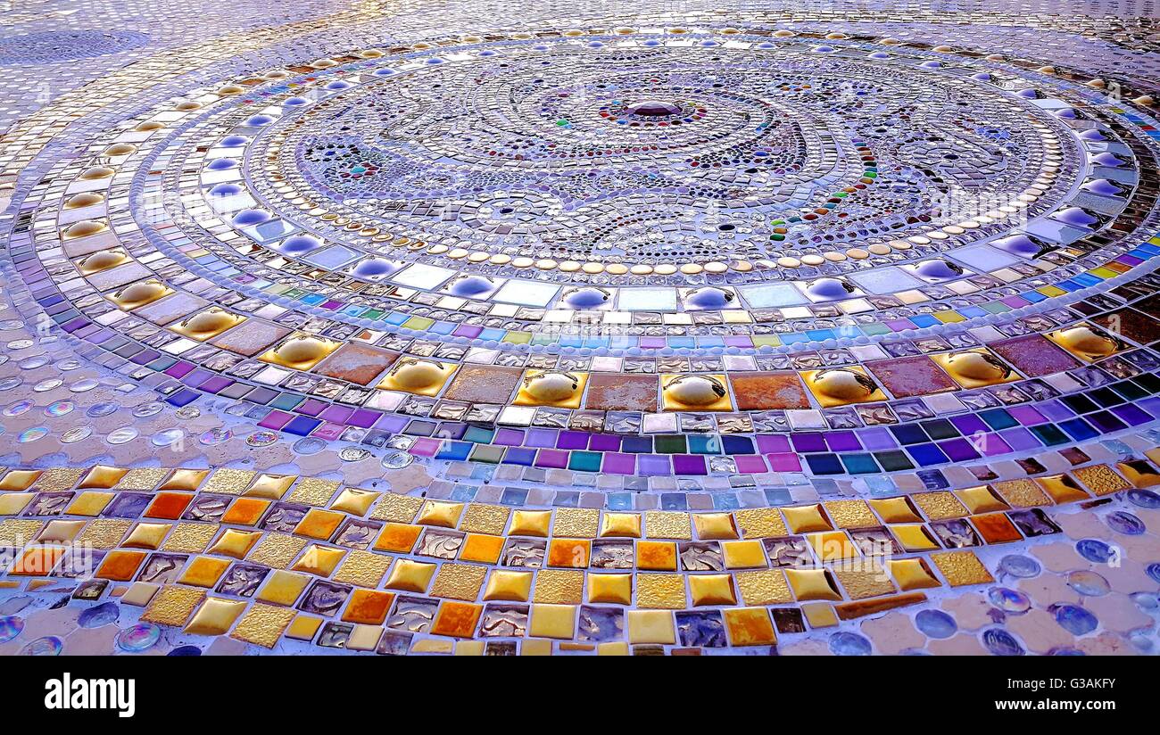 Close up of Spiral pattern purple and gold colors mosaic floor Stock Photo
