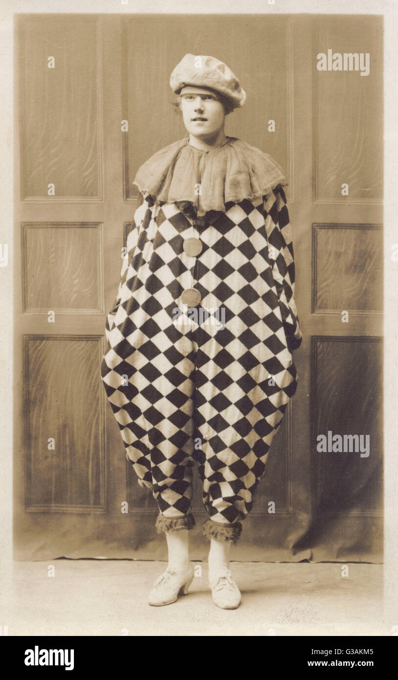 A gentleman in (most of) a Pierrot costume, although he seems to feel that  his Mother's