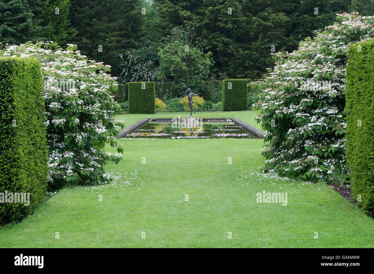 Ornamental garden statue and pond in the garden at Waterperry Gardens, Oxfordshire, England Stock Photo