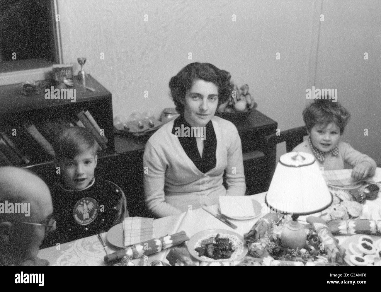 Family Christmas Dinner - 1950s Stock Photo