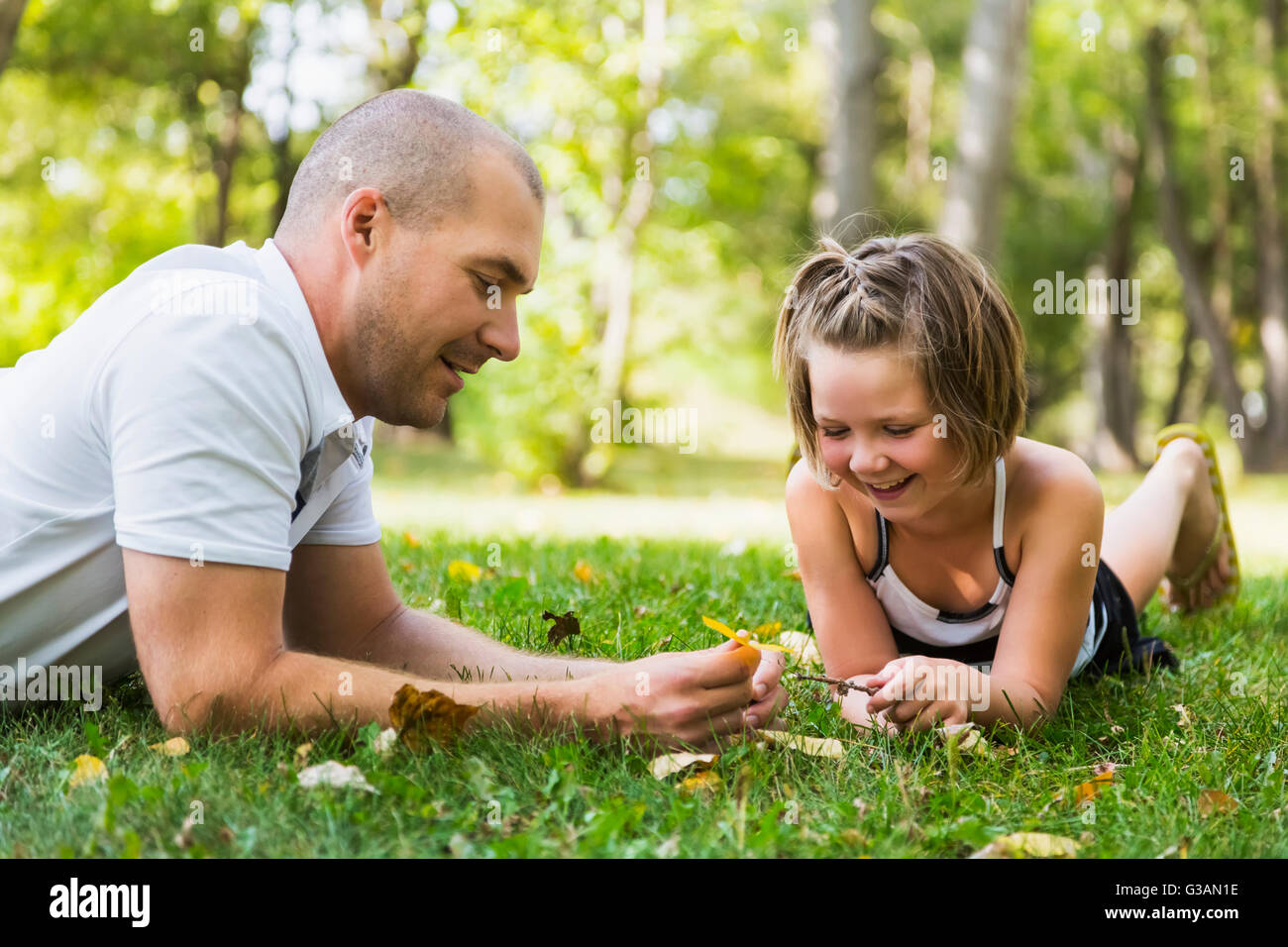 A father spending quality time with his daughter in a park during a family outing; Edmonton, Alberta, Canada Stock Photo