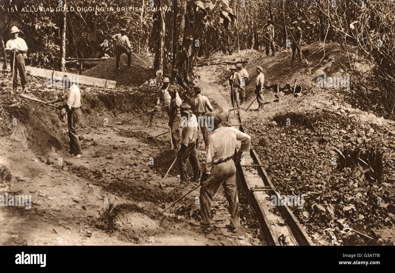 Digging for gold in British Guiana (now Guyana). Placer washing as carried out by the tributor or 'Port Knocker'.     Date: circa 1910s Stock Photo