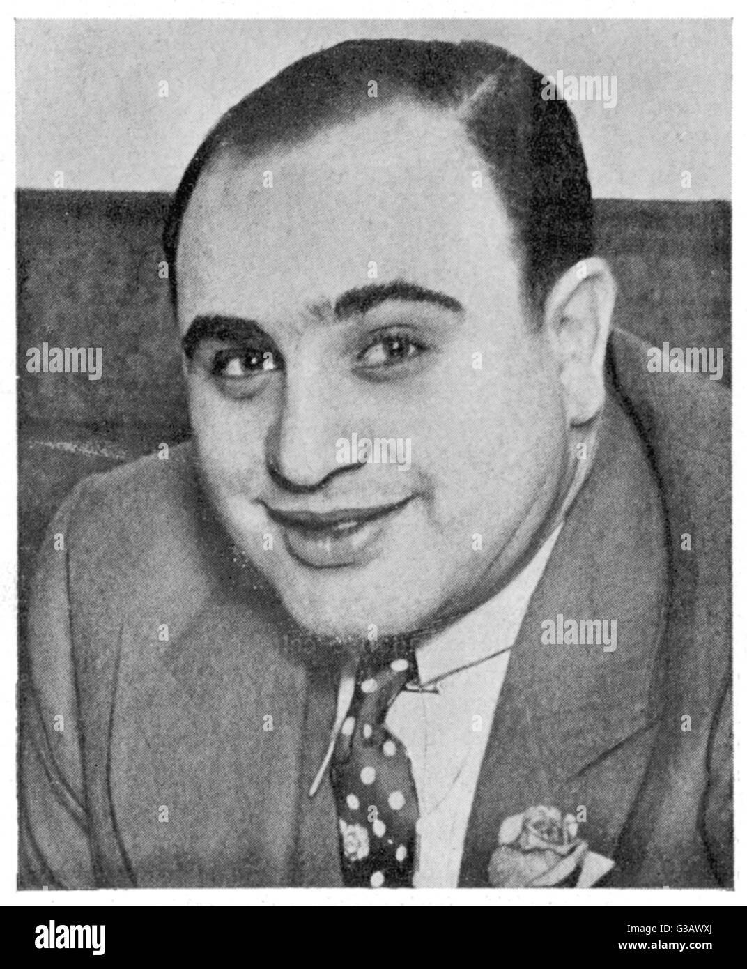 Alphonse 'Scarface' Capone,  a prominent citizen of Chicago  who unfortunately experienced  trouble with the Internal  Revenue service      Date: 1930 Stock Photo