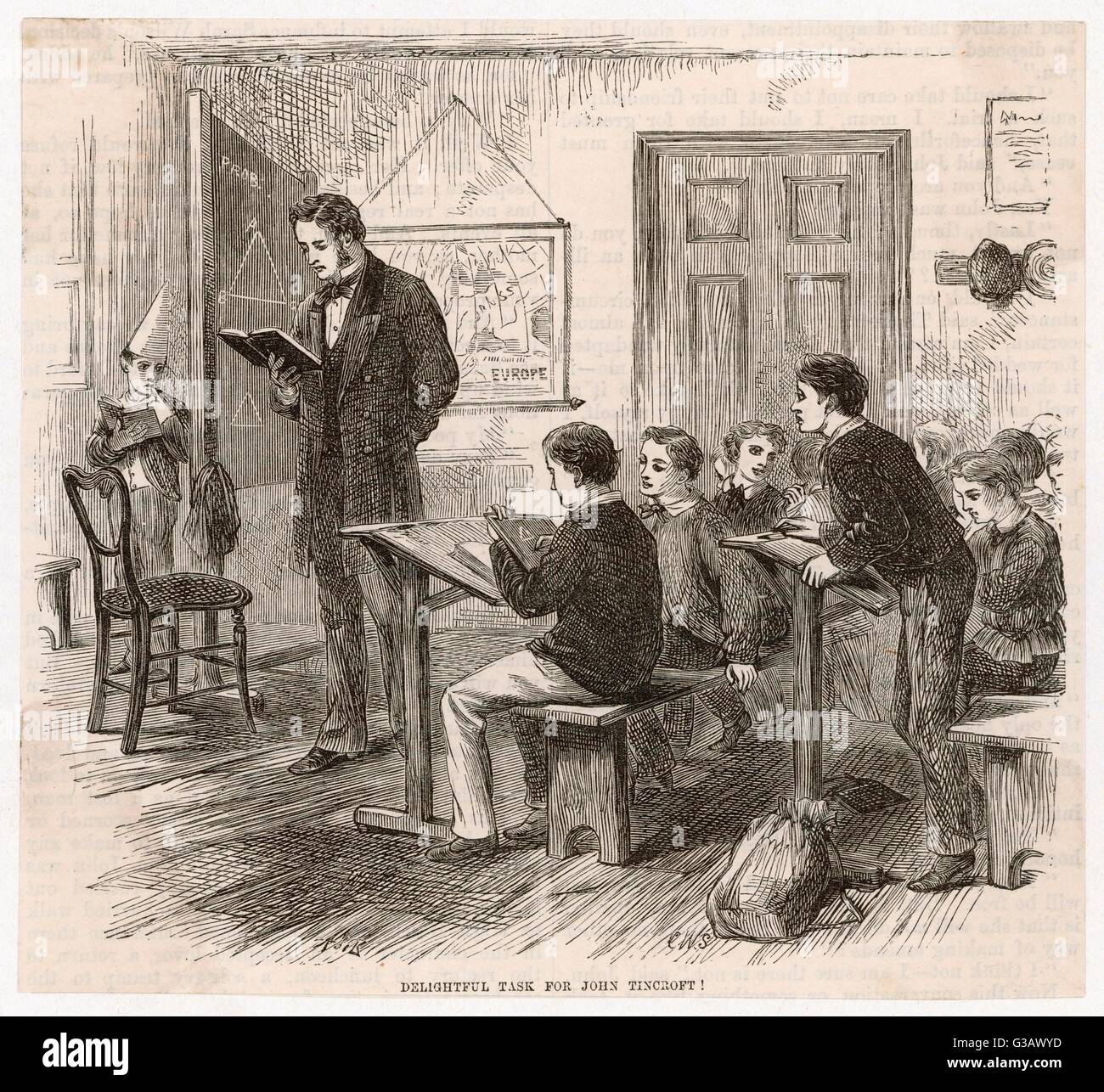 A teacher conducts a  mathematics class while a boy  wearing the dunce's cap stands  mournfully behind the  blackboard.      Date: 1872 Stock Photo