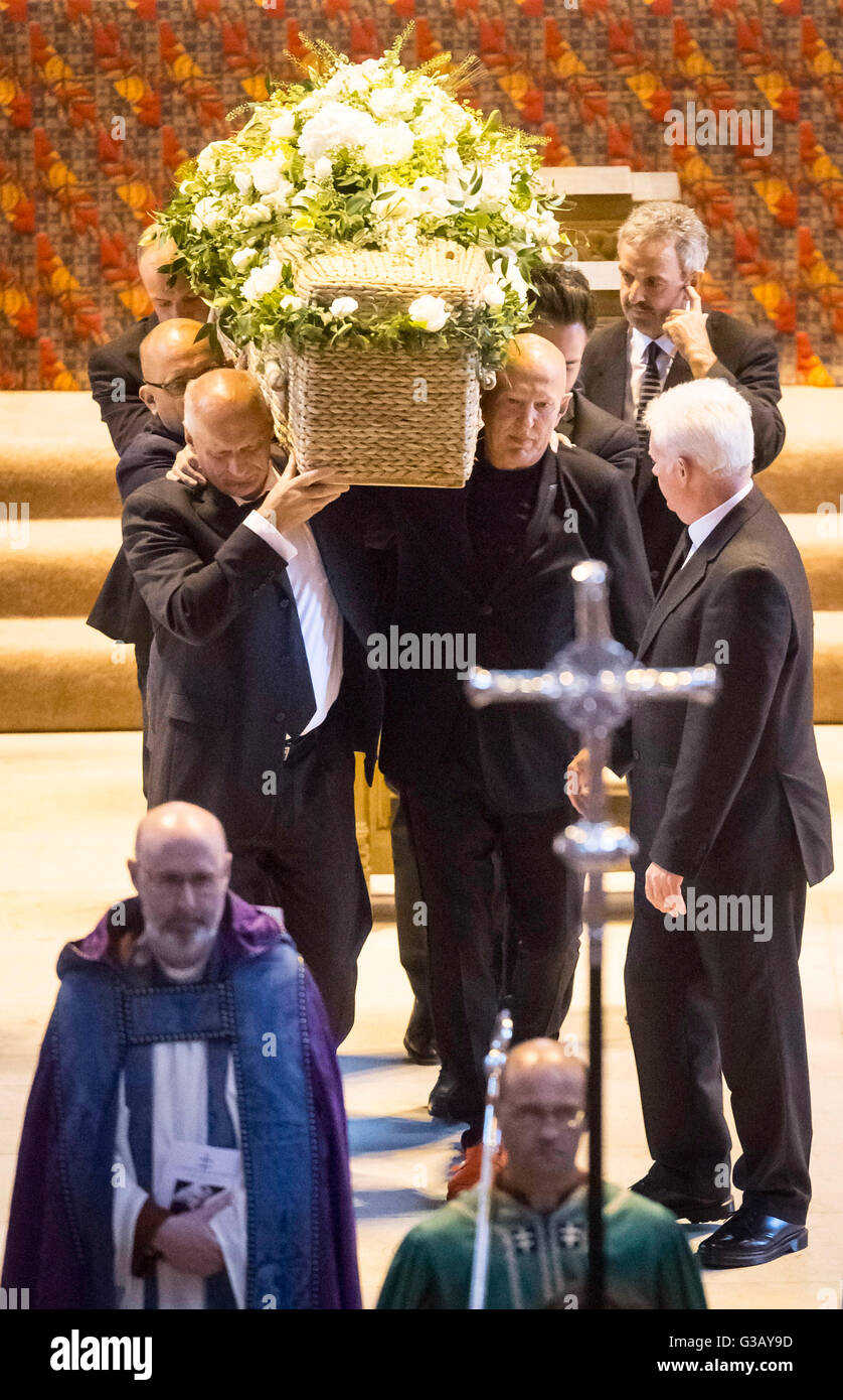The coffin of television writer Carla Lane is carried from Liverp image