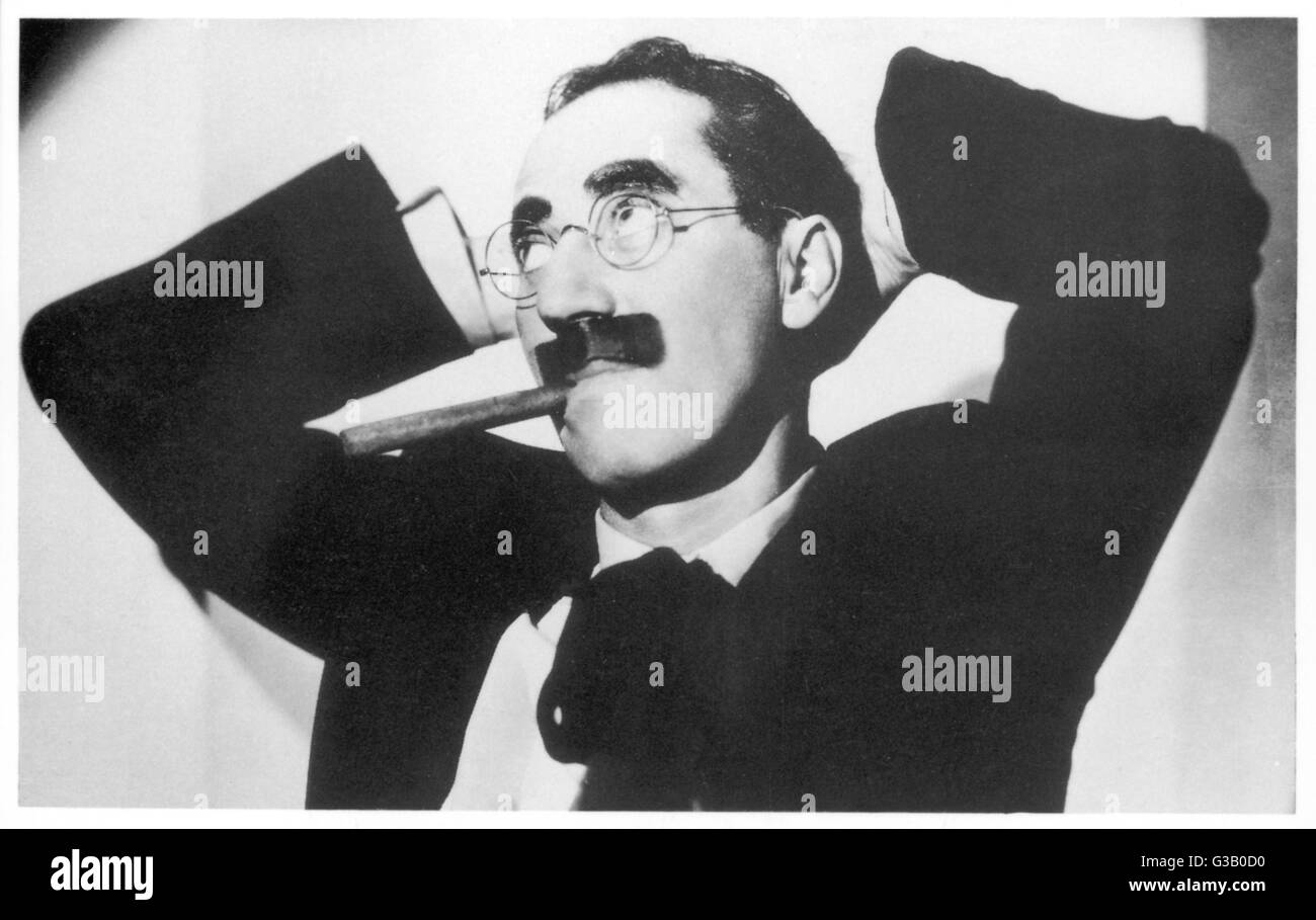 GROUCHO MARX (Julius Marx)  American comedian with his  characteristic cigar and painted-on moustache     Date: 1895 - 1977 Stock Photo