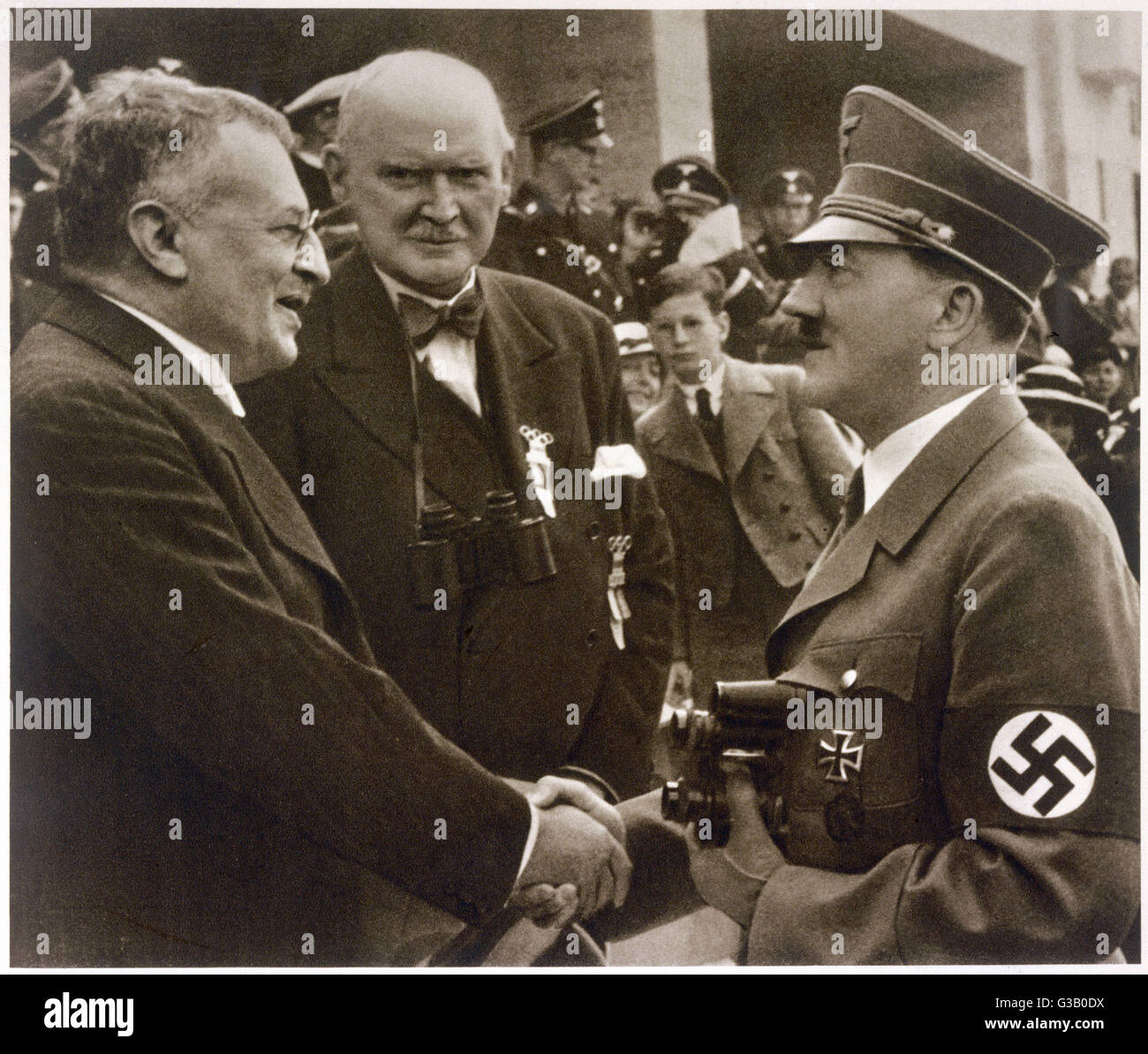Shaking hands with Sven Anders  HEDIN, Swedish traveller,  at the Berlin Olympic Games        Date: 1936 Stock Photo