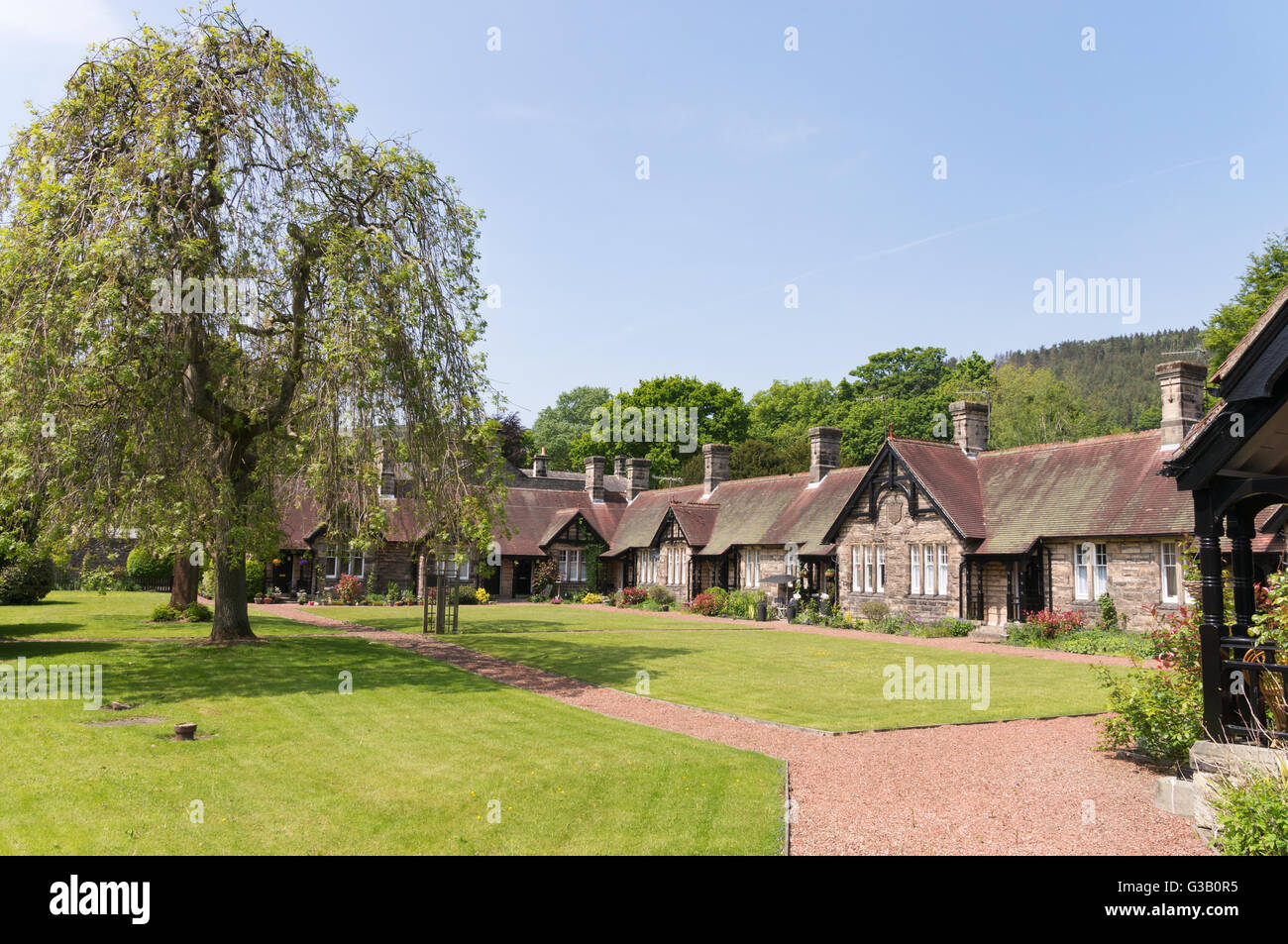 Armstrong cottages, Victorian almshouses, Rothbury, Northumberland, England, UK Stock Photo