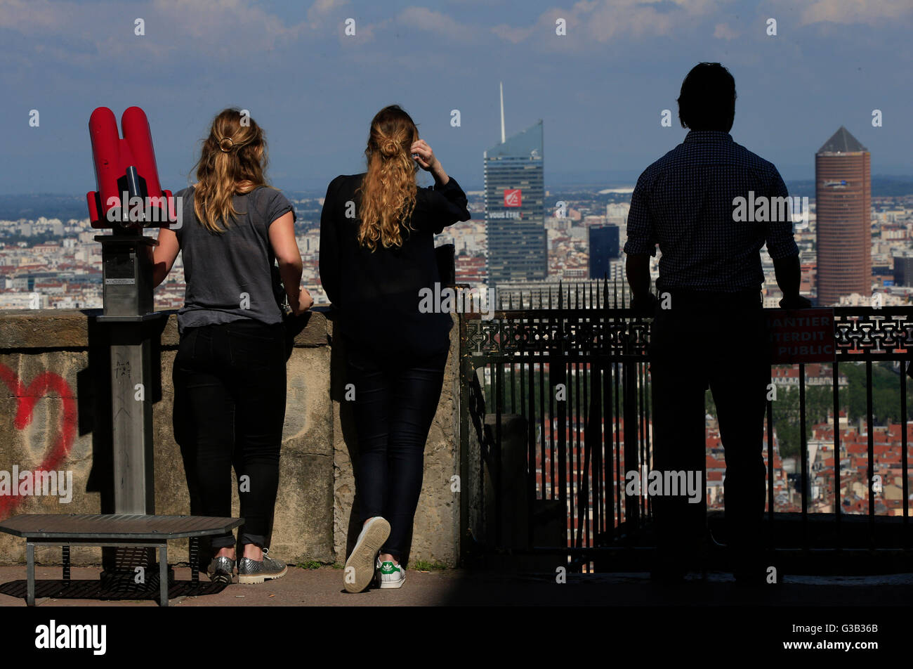 Visitors look towards the Olympic Lyonnais stadium from the Basilica of Notre-Dame de Fourviere, Lyon, France. PRESS ASSOCIATION Photo. Picture date: Thursday June 9, 2016. Photo credit should read: Jonathan Brady/PA Wire Stock Photo