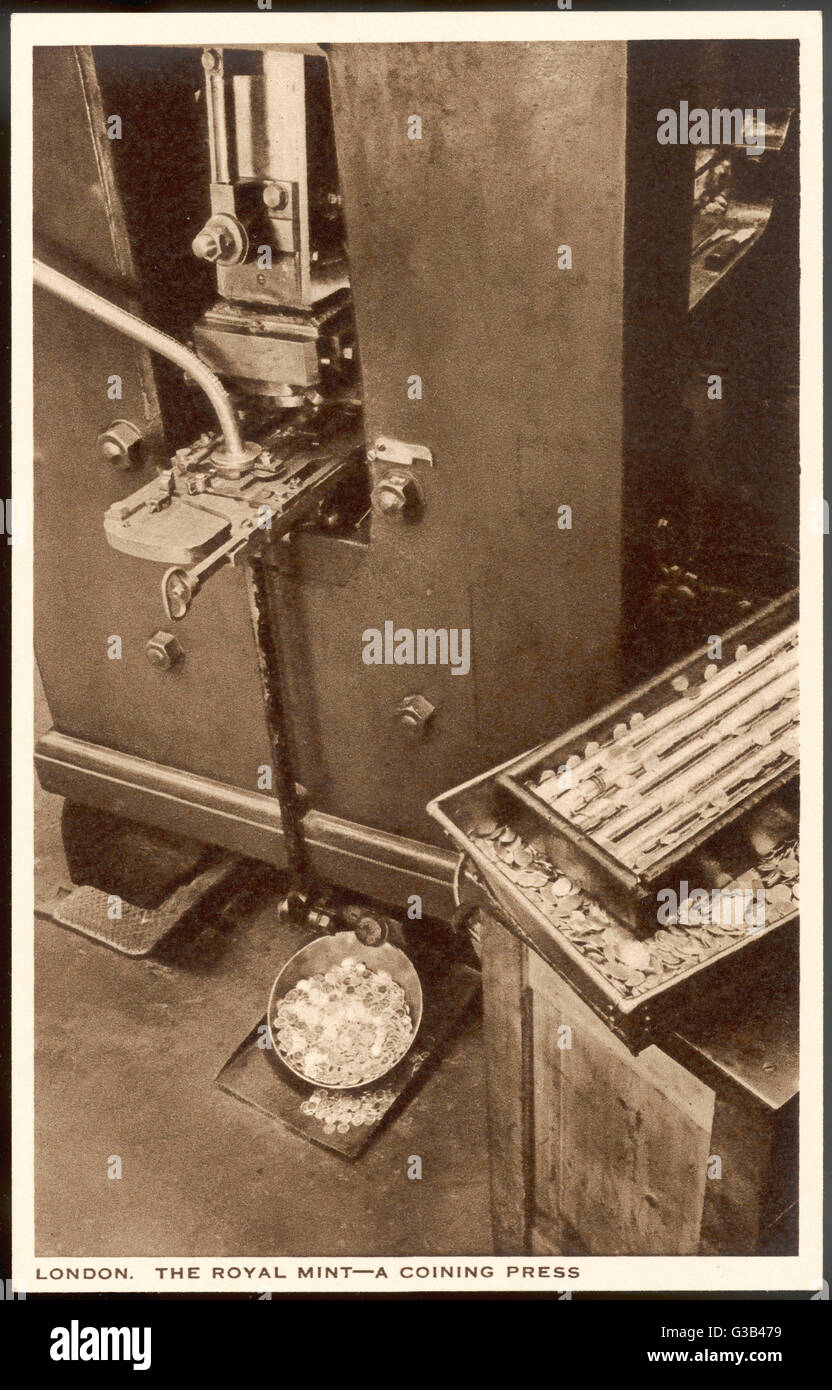 A close-up view of a coining  press        Date: circa 1910 Stock Photo