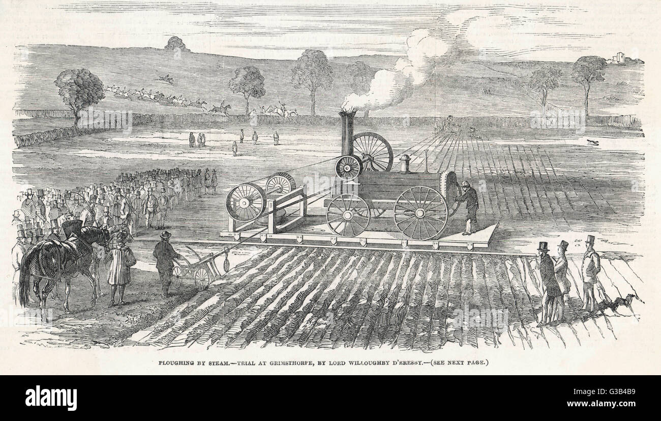 A crowd of interested  spectators come to watch the  trial of a steam plough on the  Grimsthorpe estate of Lord  Willoughby d'Eresby      Date: 1850 Stock Photo