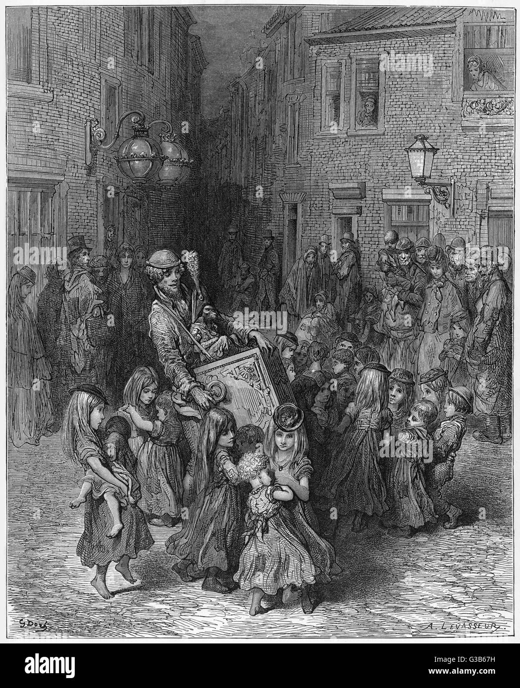 Slum children in a London court dance to the music of a barrel organ