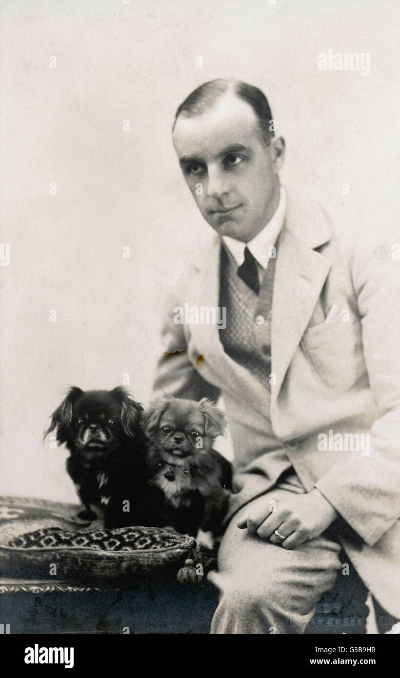 Studio Portrait A French Man Sits With His Two Pekingese Dogs On A Cushion Date Circa 1920 Stock Photo Alamy