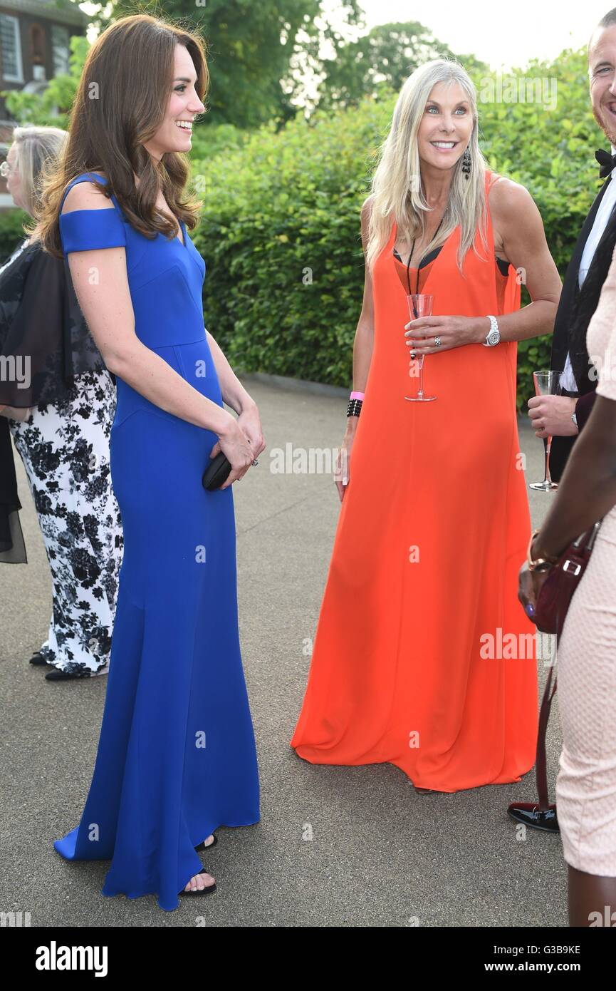 The Duchess of Cambridge (left) talks to guests, including Olympic swimmer Sharron Davies (right) prior to SportsAid's 40th anniversary dinner at Kensington Palace, London, to meet SportsAid ambassadors and young athletes who will be competing in the forthcoming Rio 2016 Olympics. Stock Photo