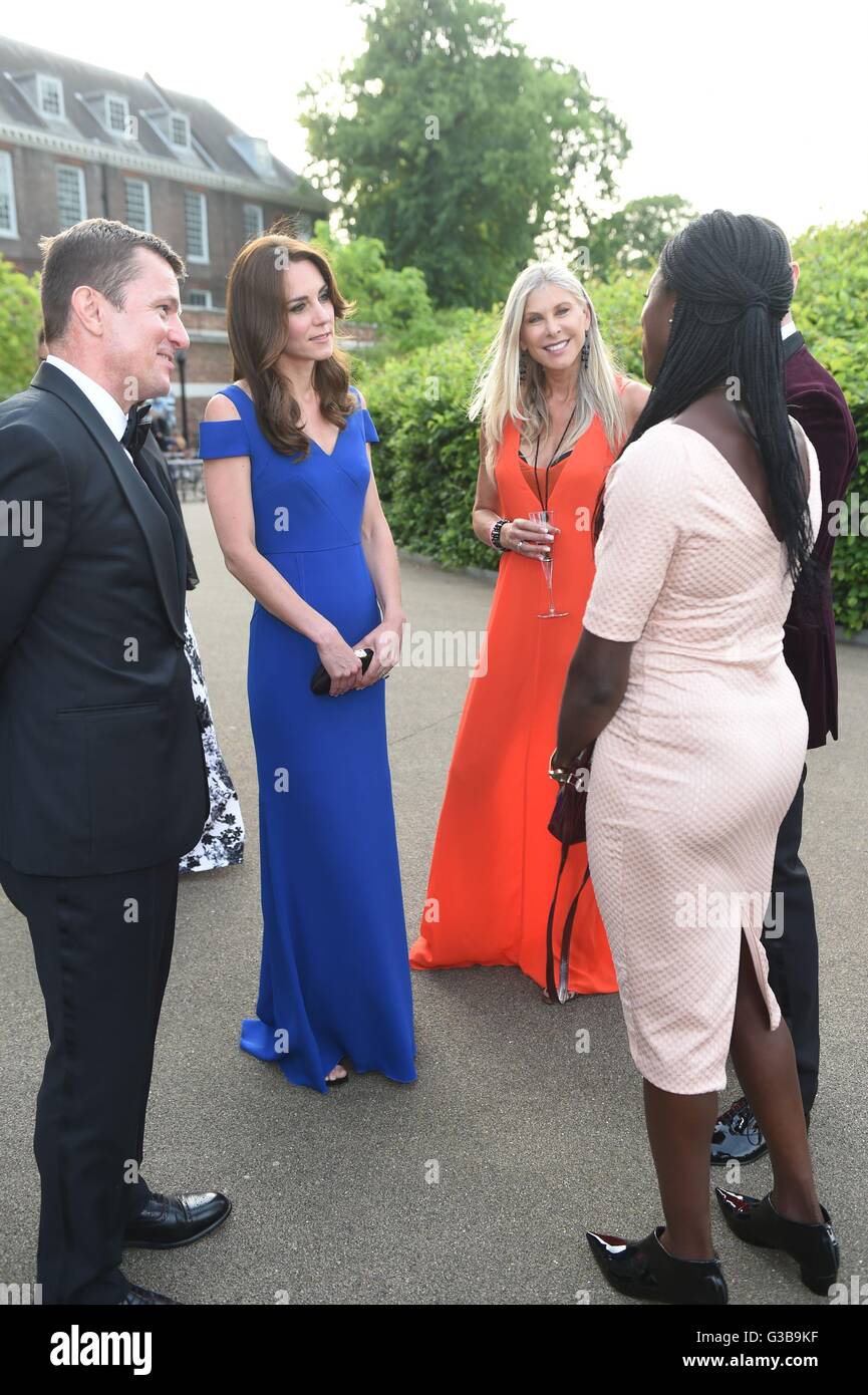 The Duchess of Cambridge (second left) talks to guests, including Olympic swimmer Sharron Davies (centre) prior to SportsAid's 40th anniversary dinner at Kensington Palace, London, to meet SportsAid ambassadors and young athletes who will be competing in the forthcoming Rio 2016 Olympics. Stock Photo