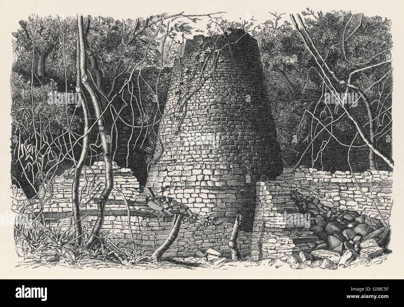 The massive conical tower in  the amazing Iron Age site of  Great Zimbabwe, the greatest  expression of the building  skills and trading wealth of  the Shona empire.     Date: 1892 Stock Photo