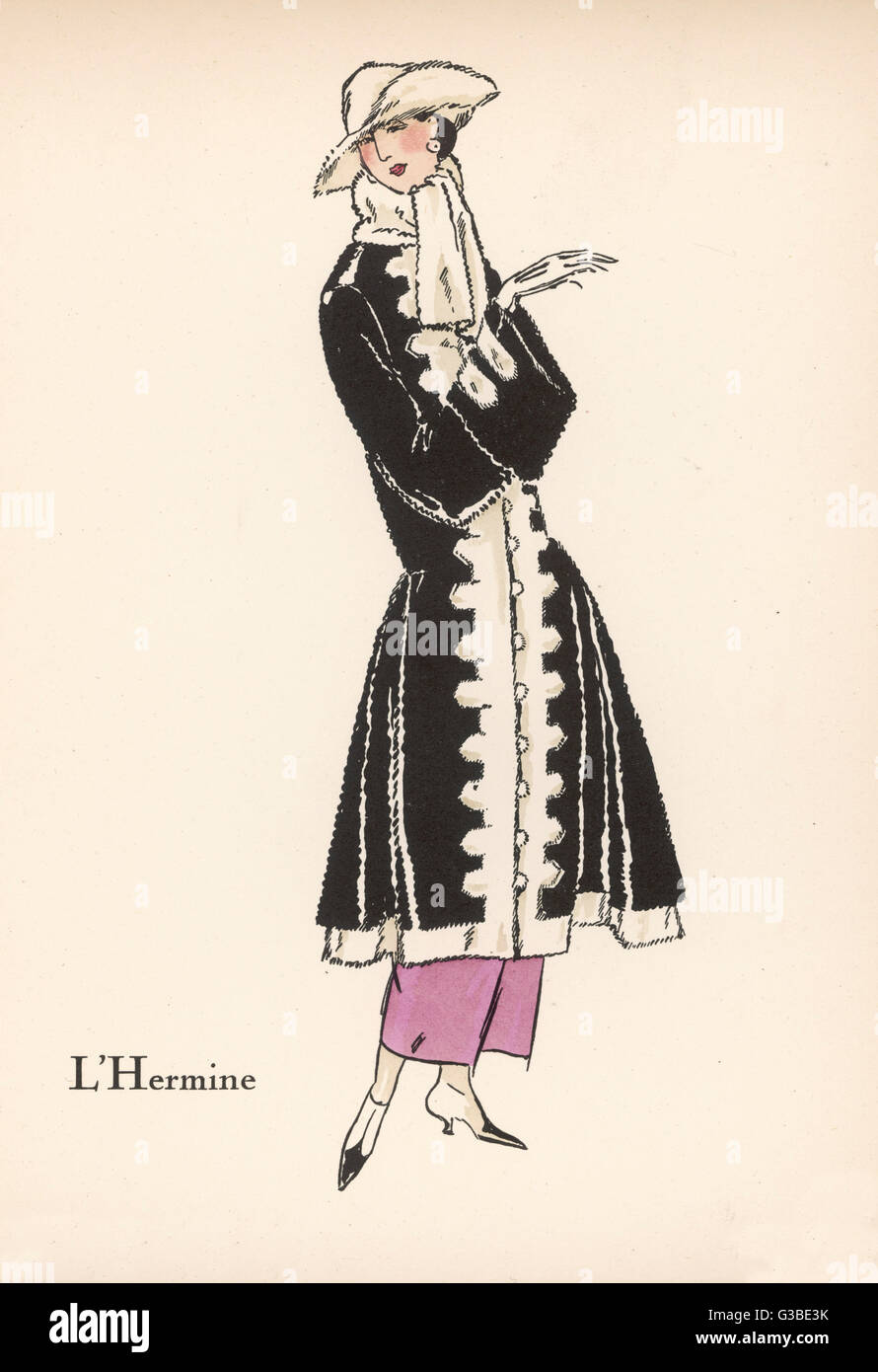 Ermine trimmed otter fur  coat with an 18th century feel  having boot cuffs &amp; imitation  brandenbourgs, a flared  skirts.  worn with a fur scarf  &amp; hat with a cocked brim.     Date: 1922 Stock Photo