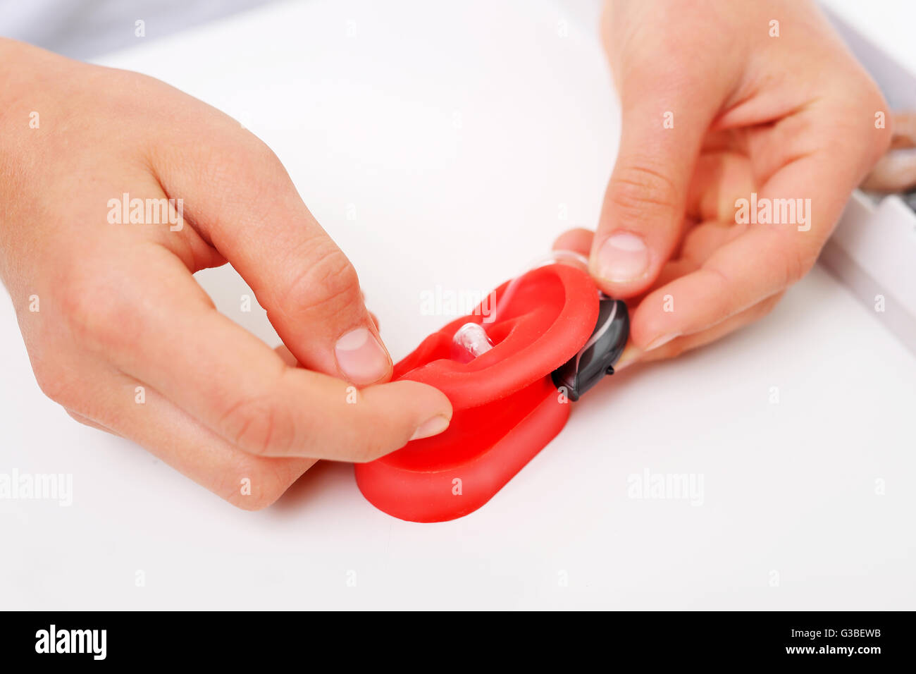 How to wear a hearing aid? Stock Photo