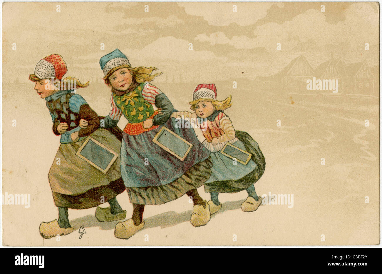 Three Dutch girls going to  school with their slates  hanging from their waists.       Date: 19th century? Stock Photo