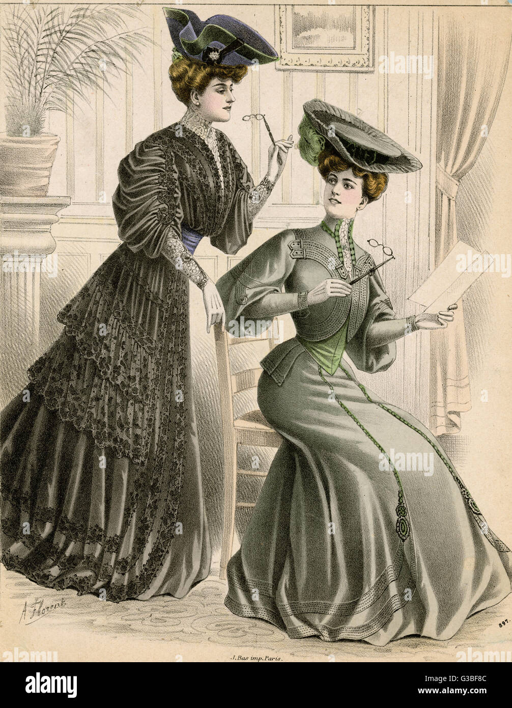 Costumes with tablier skirts &amp;  sleeves that are full on the  upper arm. One has a bolero style  jacket bodice, the other lace flounces. Hats: tricorn hat  with rosette, large flat hat.     Date: 1905 Stock Photo