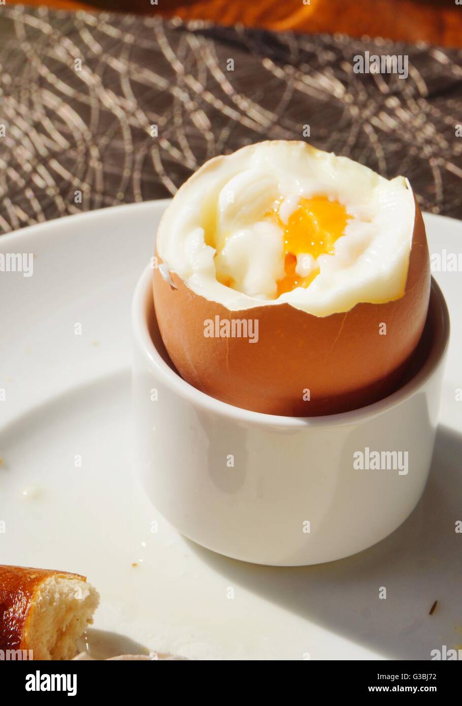 Eating a soft boiled egg for breakfast Stock Photo Alamy