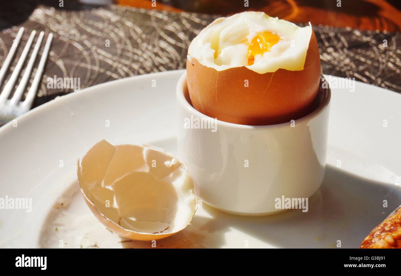 Eating a soft boiled egg for breakfast Stock Photo Alamy